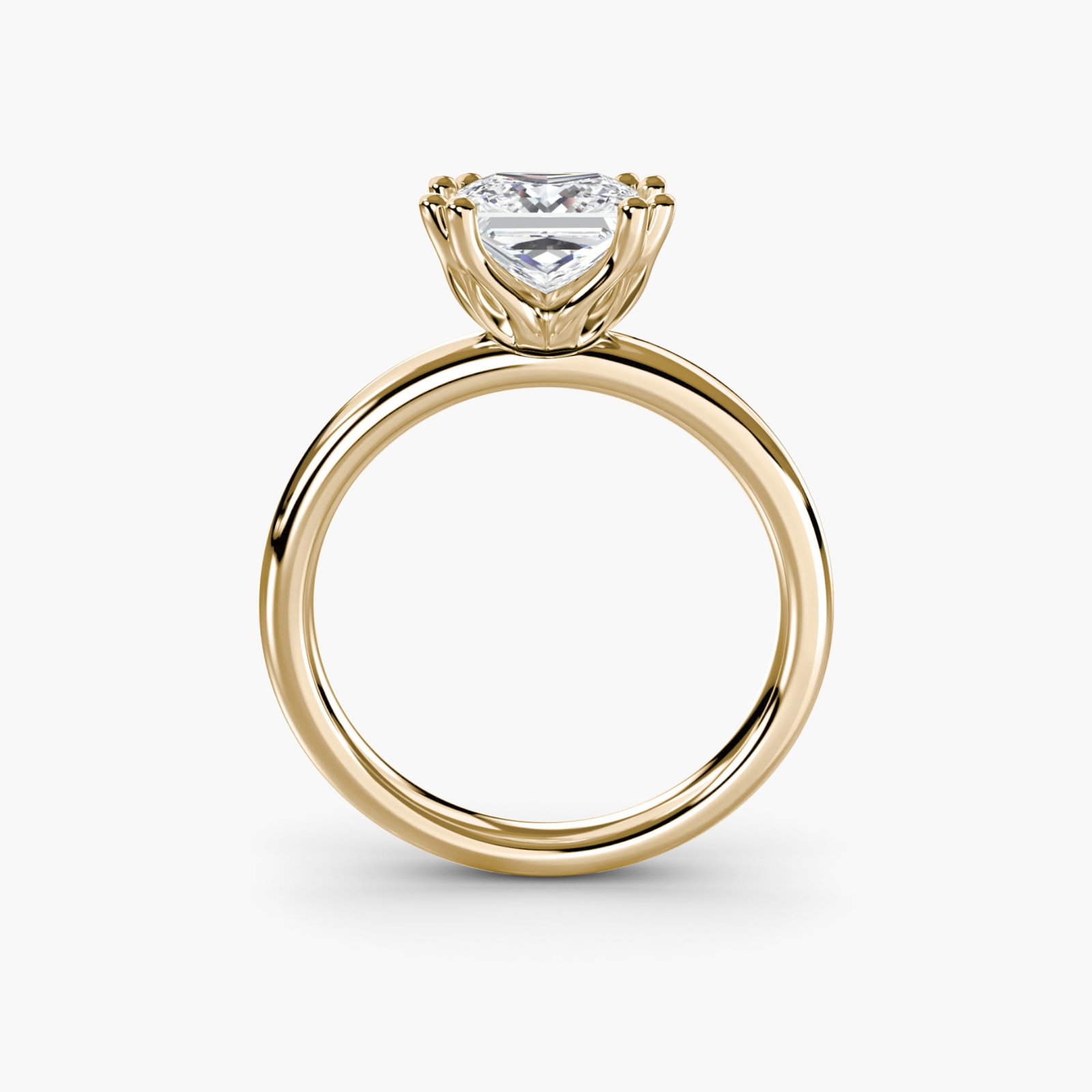 Solitaire Princess 18Kt Yellow Gold Ring Setting: Solitaire Princess 18Kt Yellow Gold Ring Setting Elegant and understated, this 18Kt yellow gold princess ring setting is perfect for those who appreciate simplicity and sophistication. With its delica