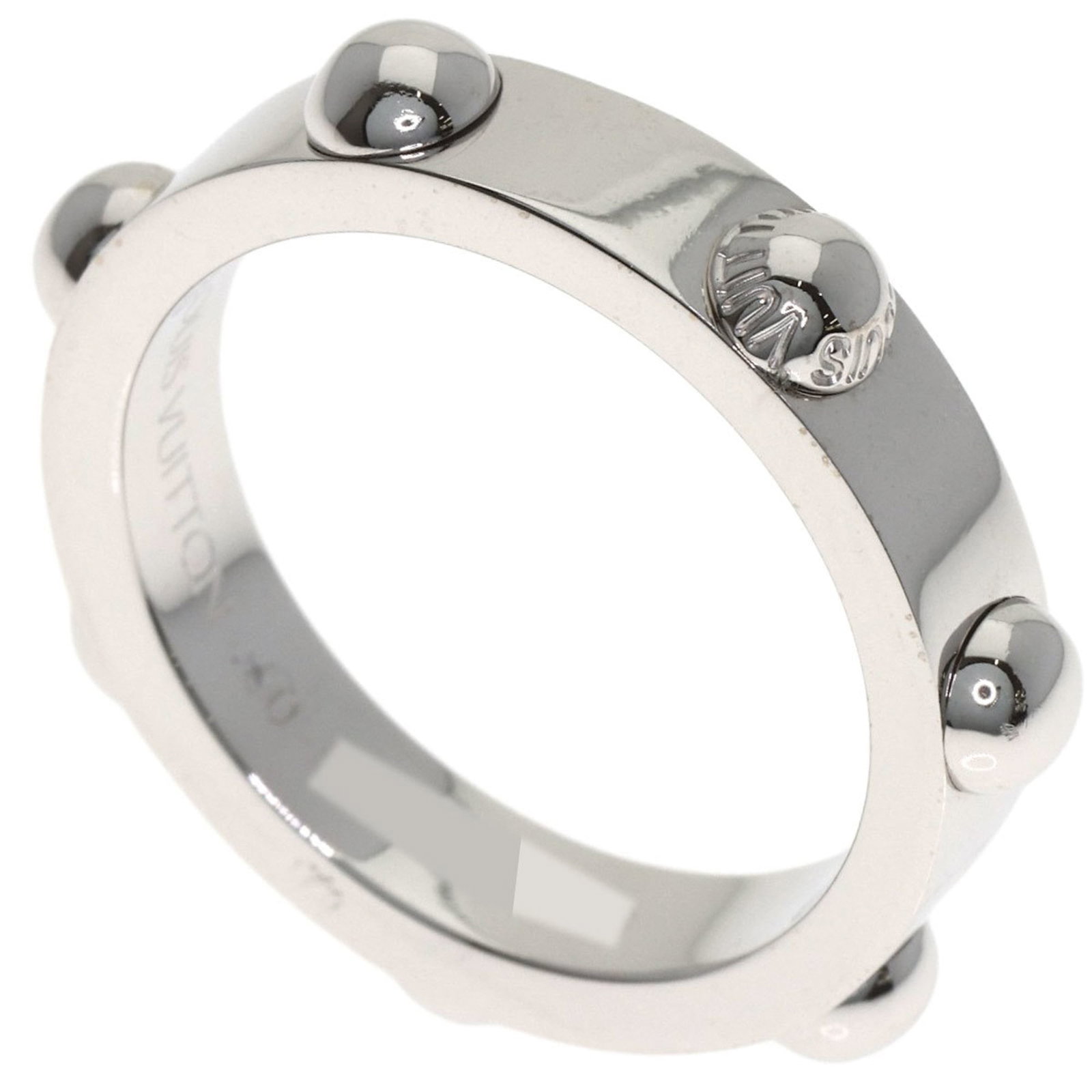 Louis Vuitton White Gold 18K Band Ring: Louis Vuitton White Gold 18K Band Ring A sleek and sophisticated band ring from Louis Vuitton, crafted in 18K white gold for a touch of luxury. With a few subtle signs of wear, this pre-owned piece