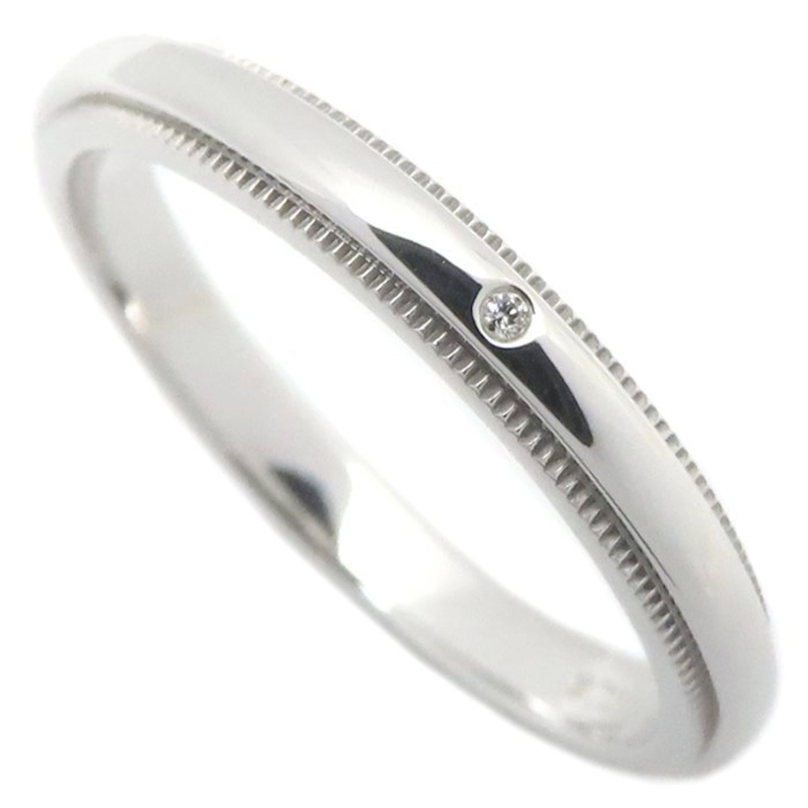 Tiffany Band Ring Platinum 950: Tiffany Band Ring Platinum 950 A luxurious platinum band ring from Tiffany, featuring a diamond stone and crafted from 950 platinum for durability and elegance. This men's band ring boasts a sleek
