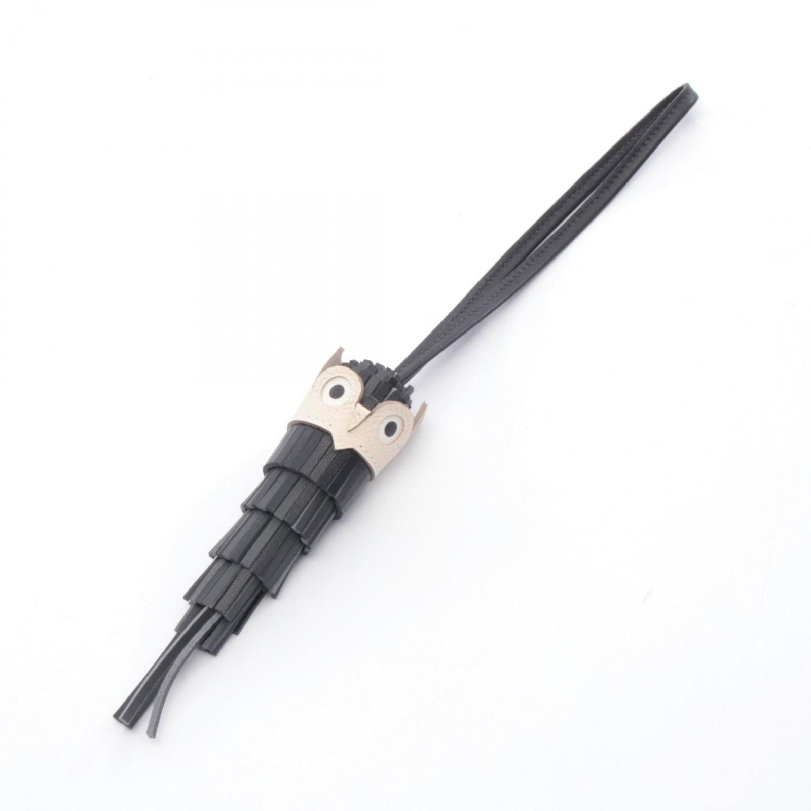 Hermes Handbag Charm Agneau Milo, Epsom Leather: Hermes Handbag Charm Agneau Milo, Epsom Leather A sleek and sophisticated accessory for any handbag, the Agneau Milo charm is crafted from high-quality Epsom leather in black, gray, or ivory hues. Thi