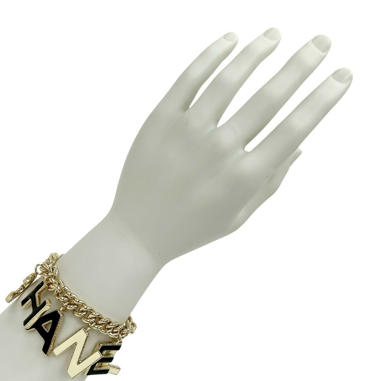Chanel gold plating charm bracelet: Chanel gold plating charm bracelet A sleek and sophisticated charm bracelet from Chanel, adorned with gold plating details in black, gold, and white hues. With its 19.5cm length, this versatile access