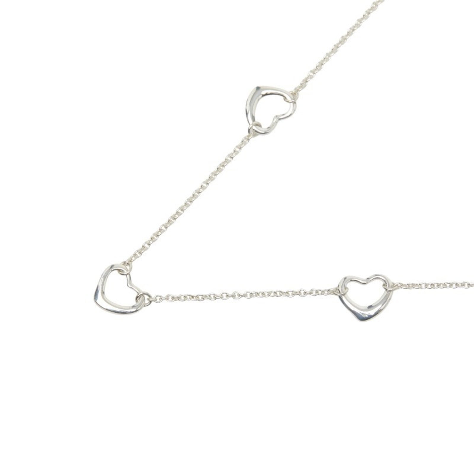 Tiffany & Co. Open Heart 3-Motif Necklace in 925 Sterling Silver for Women.: Tiffany & Co. Open Heart 3-Motif Necklace in 925 Sterling Silver for Women. A stunning Tiffany & Co. Open Heart 3-Motif Necklace in 925 Sterling Silver, featuring intricate details and classic
