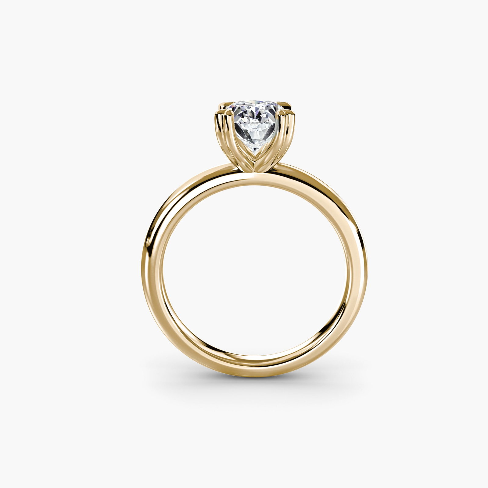 Solitaire Oval 18Kt Yellow Gold Ring Setting: Solitaire Oval 18Kt Yellow Gold Ring Setting Elegant simplicity is at the heart of this 18Kt Yellow Gold Oval Ring Setting, where a slender band wraps around an oval-shaped setting, perfect for showca