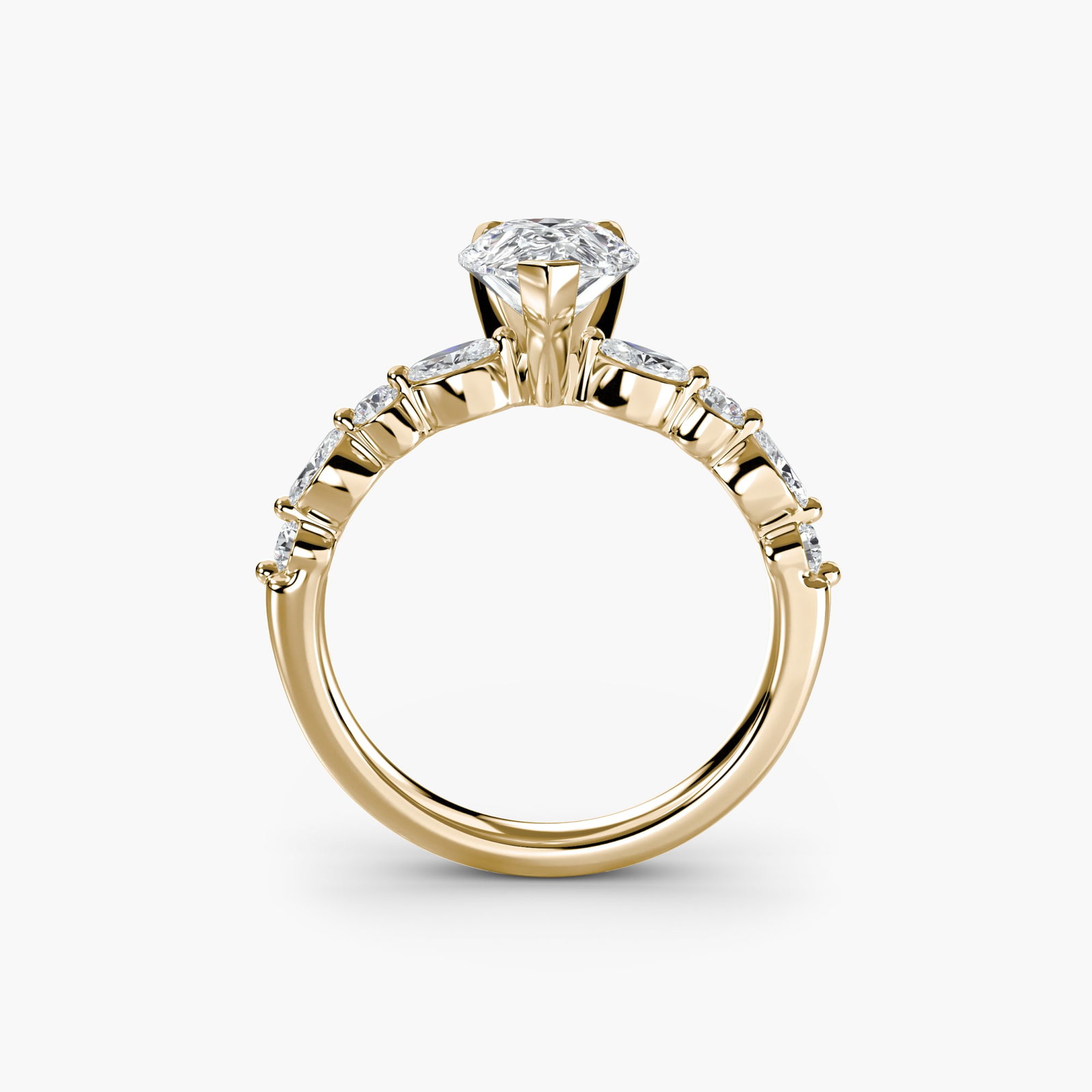 Pave Pear 14Kt Yellow Gold Ring Setting: Pave Pear 14Kt Yellow Gold Ring Setting Elegant and understated, this 14Kt yellow gold pave ring setting is perfect for those who appreciate subtle sophistication. With its delicate pear shape and int