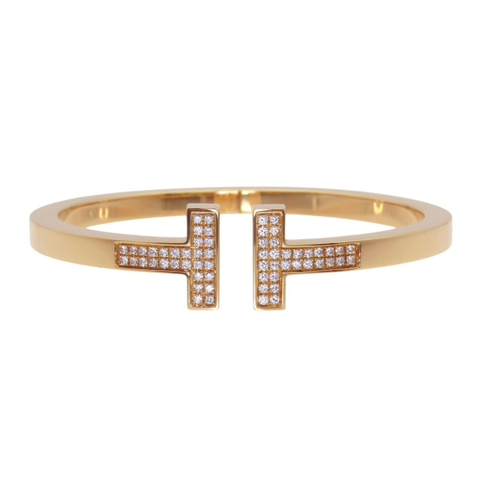 Pink Gold Tiffany Bangle: Pink Gold Tiffany Bangle A beautiful 18K pink gold bangle from Tiffany, crafted with rose gold tones and measuring 17.5cm in length, is up for auction. This lovely piece has been carefully maintained 