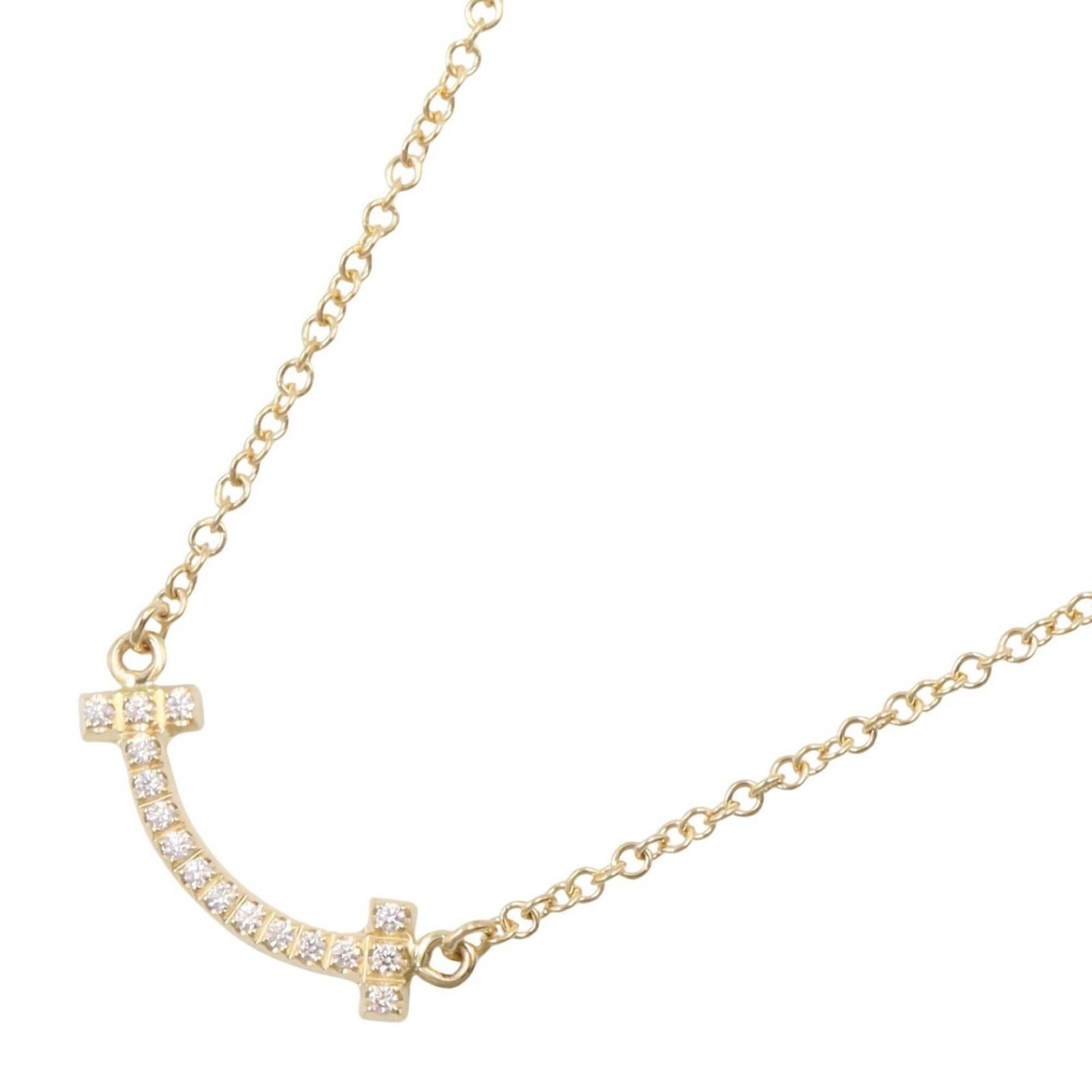 Tiffany & Co. T Smile Mini Diamond Necklace, 18K (Yellow Gold) Women's, Gold Tone, Clear Tone: Tiffany & Co. T Smile Mini Diamond Necklace, 18K (Yellow Gold) Women's, Gold Tone, Clear Tone Elegant and refined, this 18K yellow gold Tiffany & Co. necklace showcases a delicate 3mm x 14mm diamond