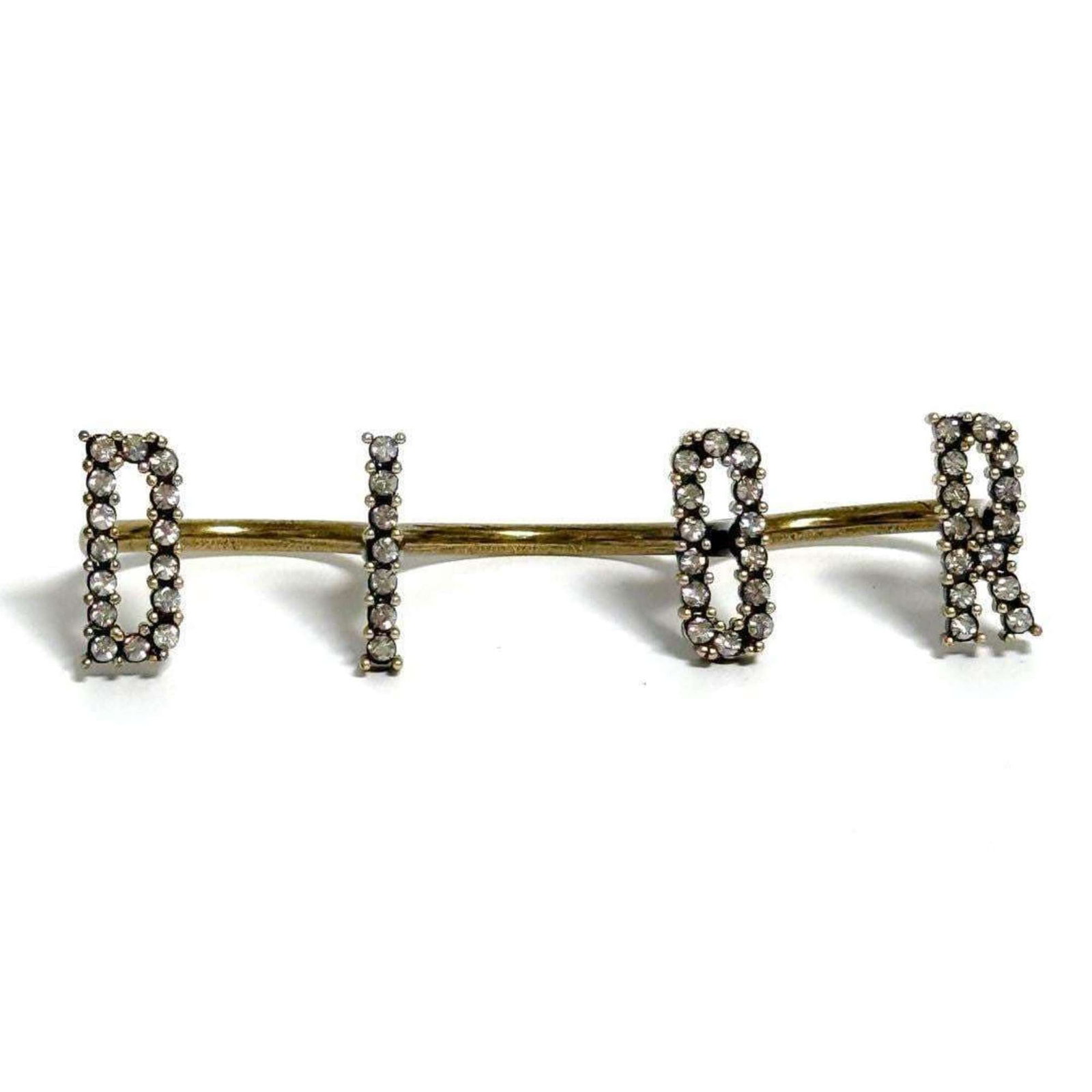 Christian Dior metal band ring: Christian Dior metal band ring A sleek and sophisticated metal band ring from Christian Dior adds a touch of luxury to any outfit. Made from high-quality metal, this ring boasts a classic design that