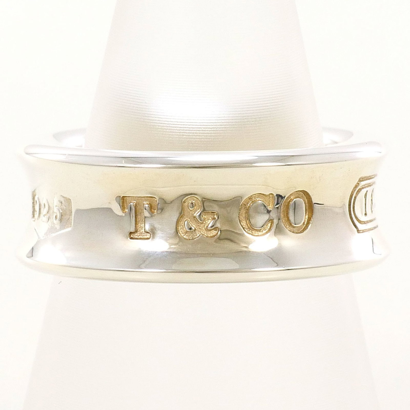 Tiffany silver ring band.: Tiffany silver ring band. A 925 sterling silver Tiffany ring band with a sleek design, this piece is crafted from high-quality metal and features a classic style that suits a woman's everyday wear. Wi