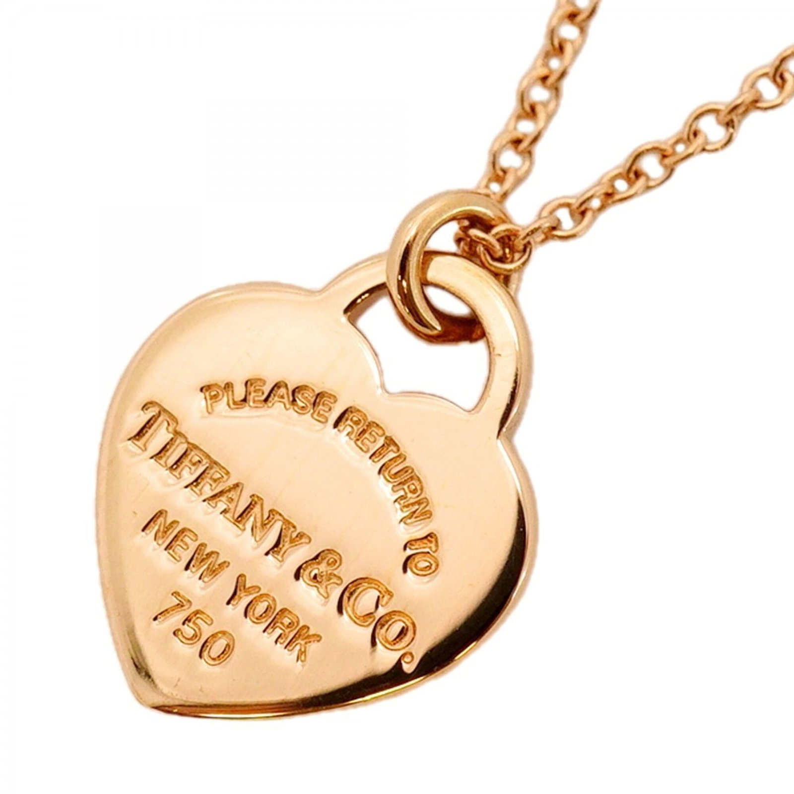 Tiffany & Co. pink gold women's mini heart tag necklace.: Tiffany & Co. pink gold women's mini heart tag necklace. A delicate pink gold heart tag necklace from Tiffany & Co., featuring a 13.6mm x 10mm pendant suspended from a chain with a adjustable neck
