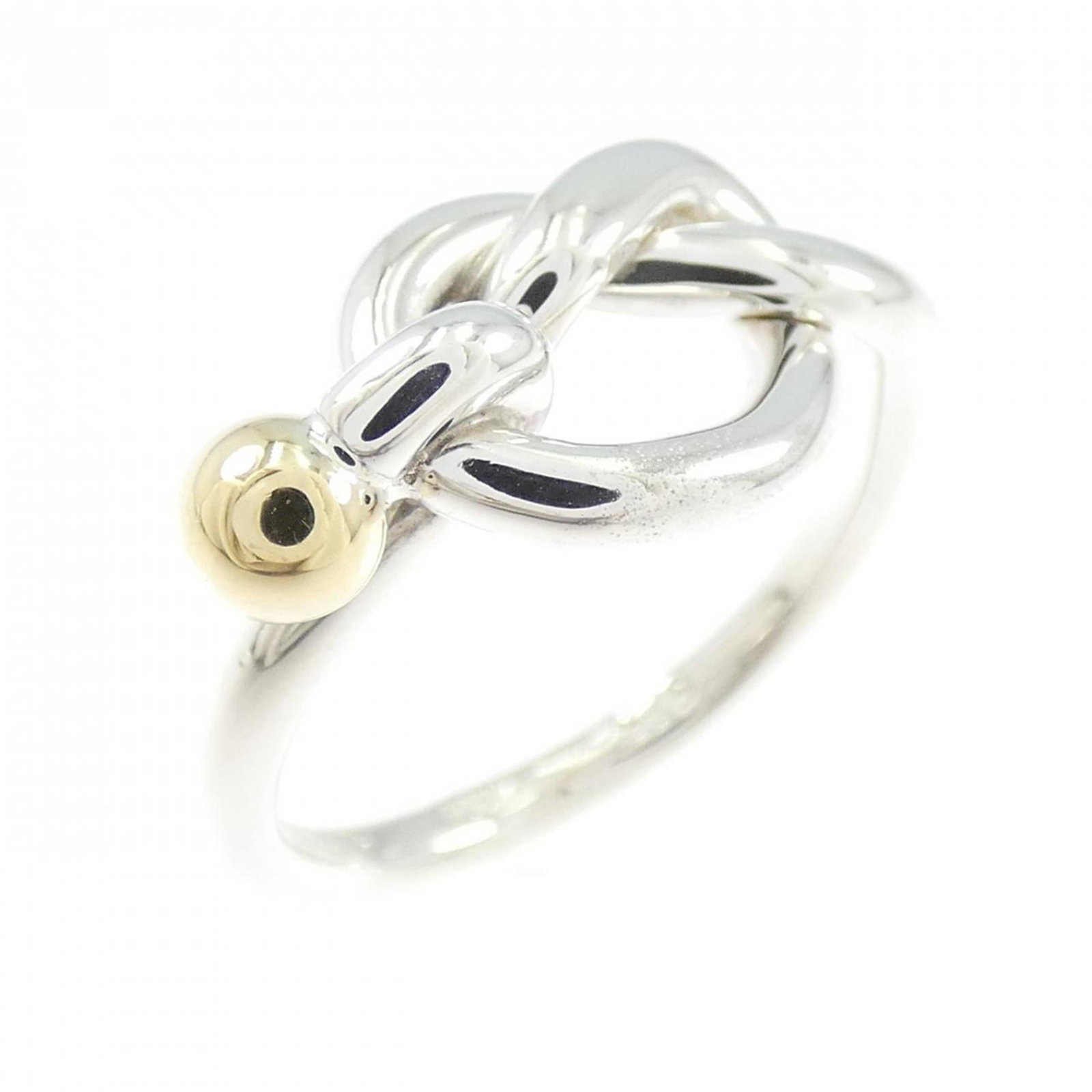 Tiffany band ring: Tiffany band ring A beautiful 18K yellow gold band ring from Tiffany, featuring a subtle sparkle in its silver-plated accents. This delicate ring boasts a classic design with a few traces of usage, sh