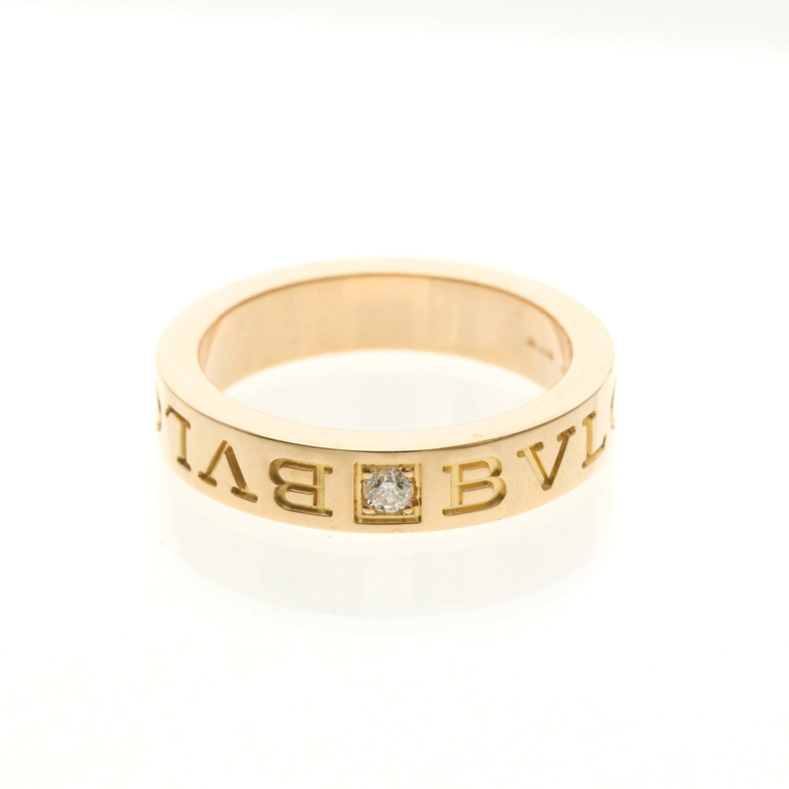 Bvlgari pink gold band ring.: Bvlgari pink gold band ring. Elevate your style with this stunning Bvlgari pink gold band ring, featuring 18K pink gold and a diamond stone. Its sleek design and slender width of 4.1mm make it a versa