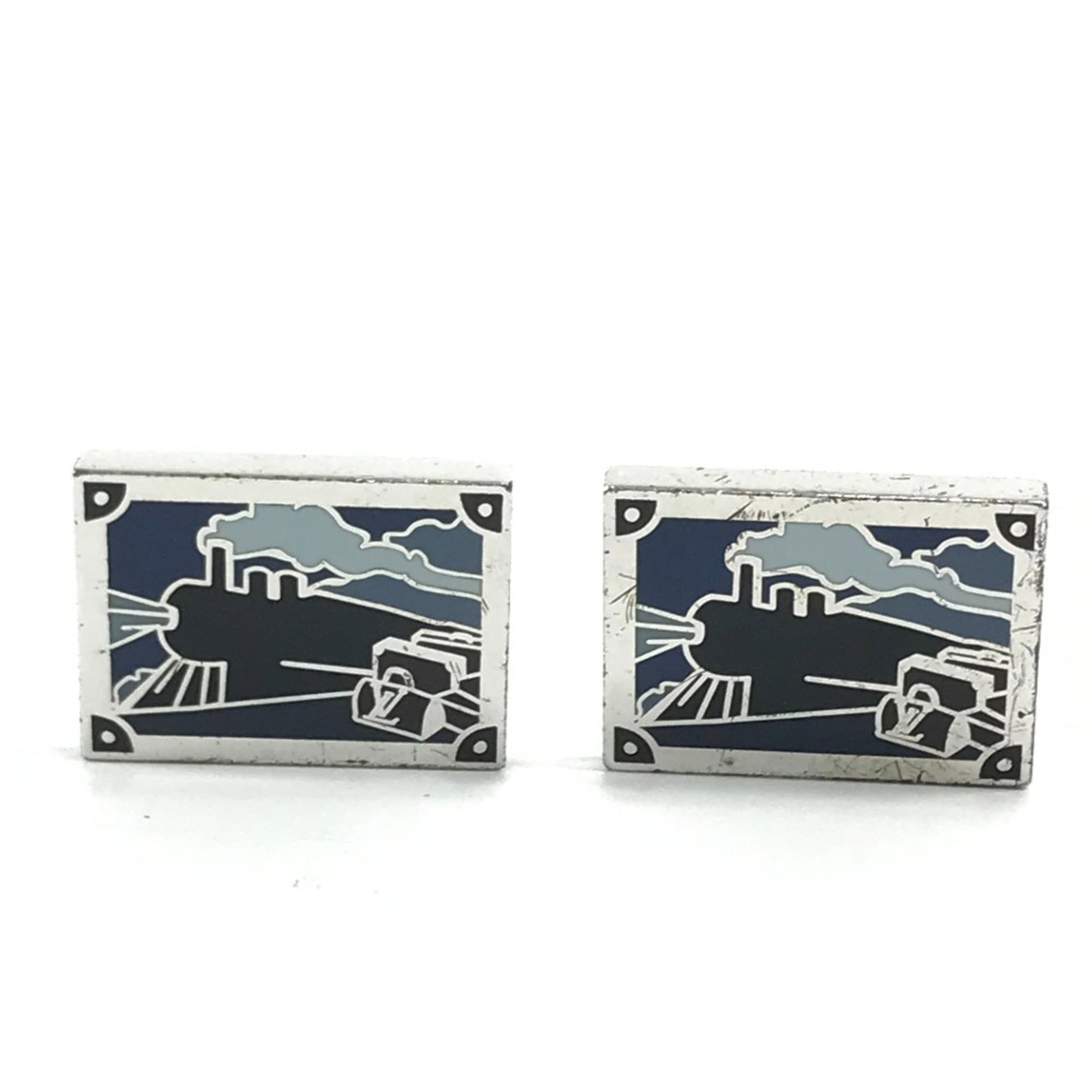 Louis Vuitton cufflinks are silver.: Louis Vuitton cufflinks are silver. These Louis Vuitton cufflinks are crafted from sterling silver (925) and feature a striking blue hue. With signs of previous wear, they still retain their sleek des