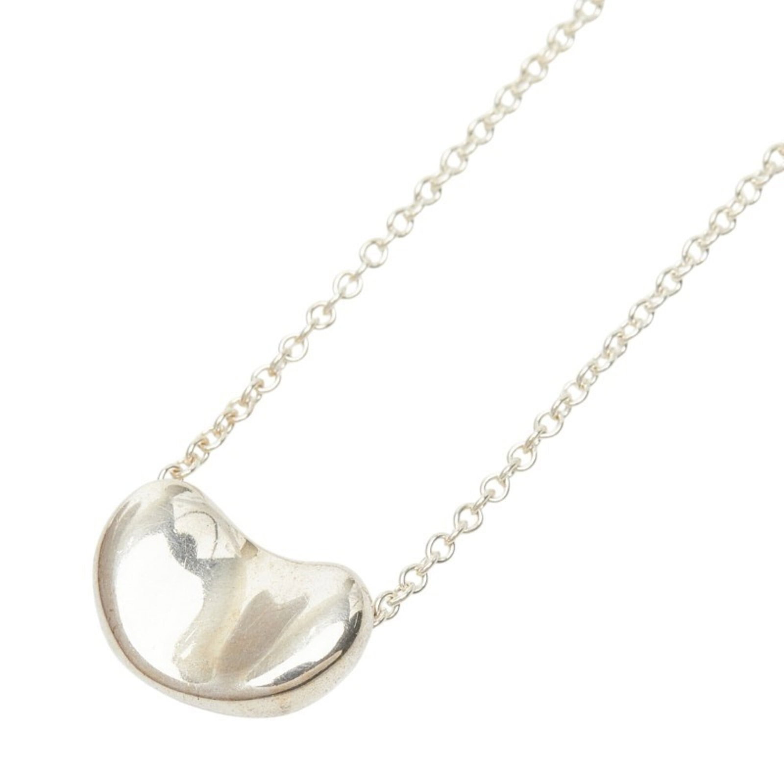 Tiffany & Co. Bean Necklace, SV925 Silver, Women's.: Tiffany & Co. Bean Necklace, SV925 Silver, Women's. A beautiful Tiffany & Co. Bean Necklace in sterling silver (925) is up for auction. This classic design features a 7.5mm x 10.5mm pendant, suspended