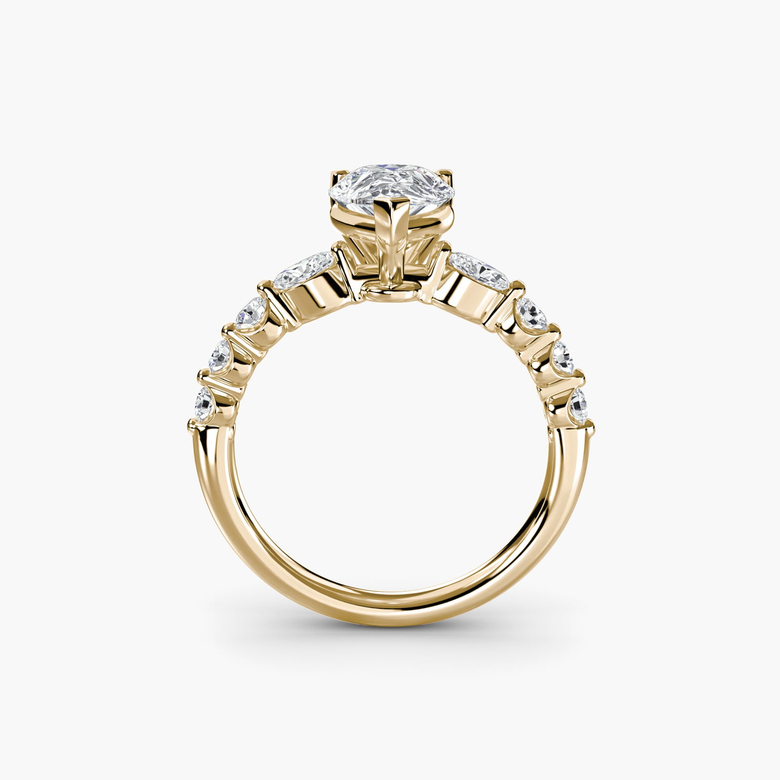 Pave Pear 14Kt Yellow Gold Ring Setting: Pave Pear 14Kt Yellow Gold Ring Setting Elegant and understated, this 14Kt yellow gold pave pear ring setting boasts 8 side stones totaling 0.29 carats of lab-grown sparkle, adding subtle shine to