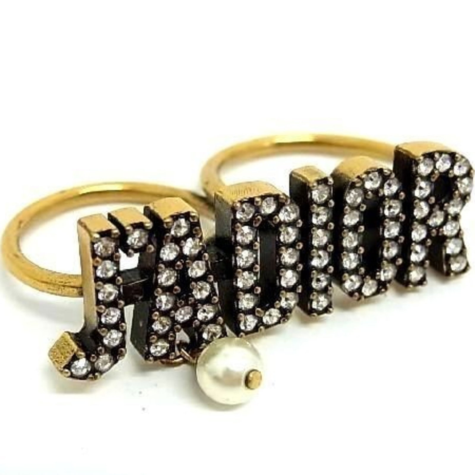 Christian Dior metal band ring: Christian Dior metal band ring A delicate touch of luxury, this Christian Dior metal band ring shines with intricate details and subtle sophistication. Crafted from gold metal and adorned with