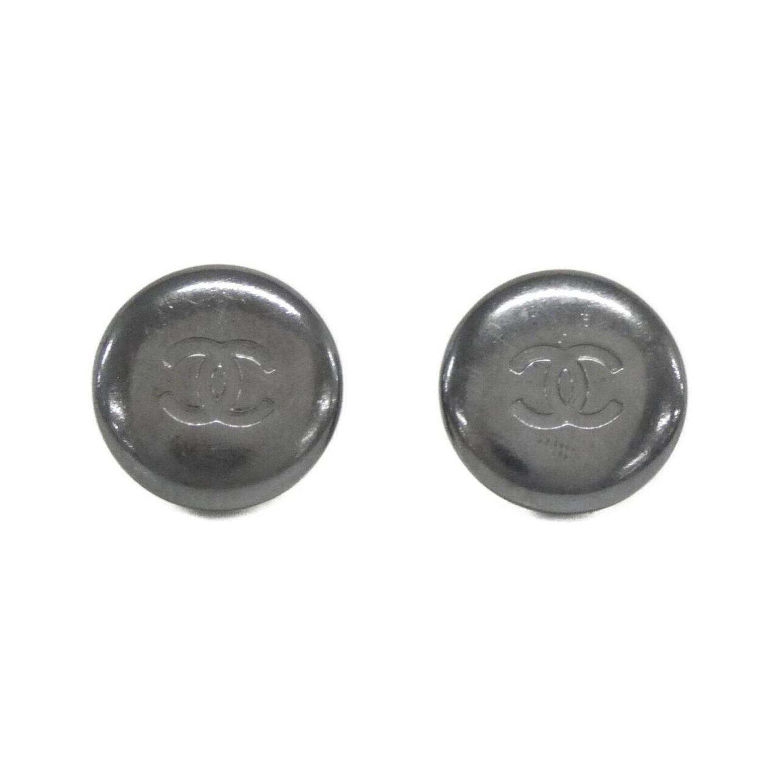 Earrings by Chanel: Earrings by Chanel Elegant silver clip earrings from iconic fashion house Chanel, featuring a timeless design that adds a touch of sophistication to any outfit. With their classic shape and sleek