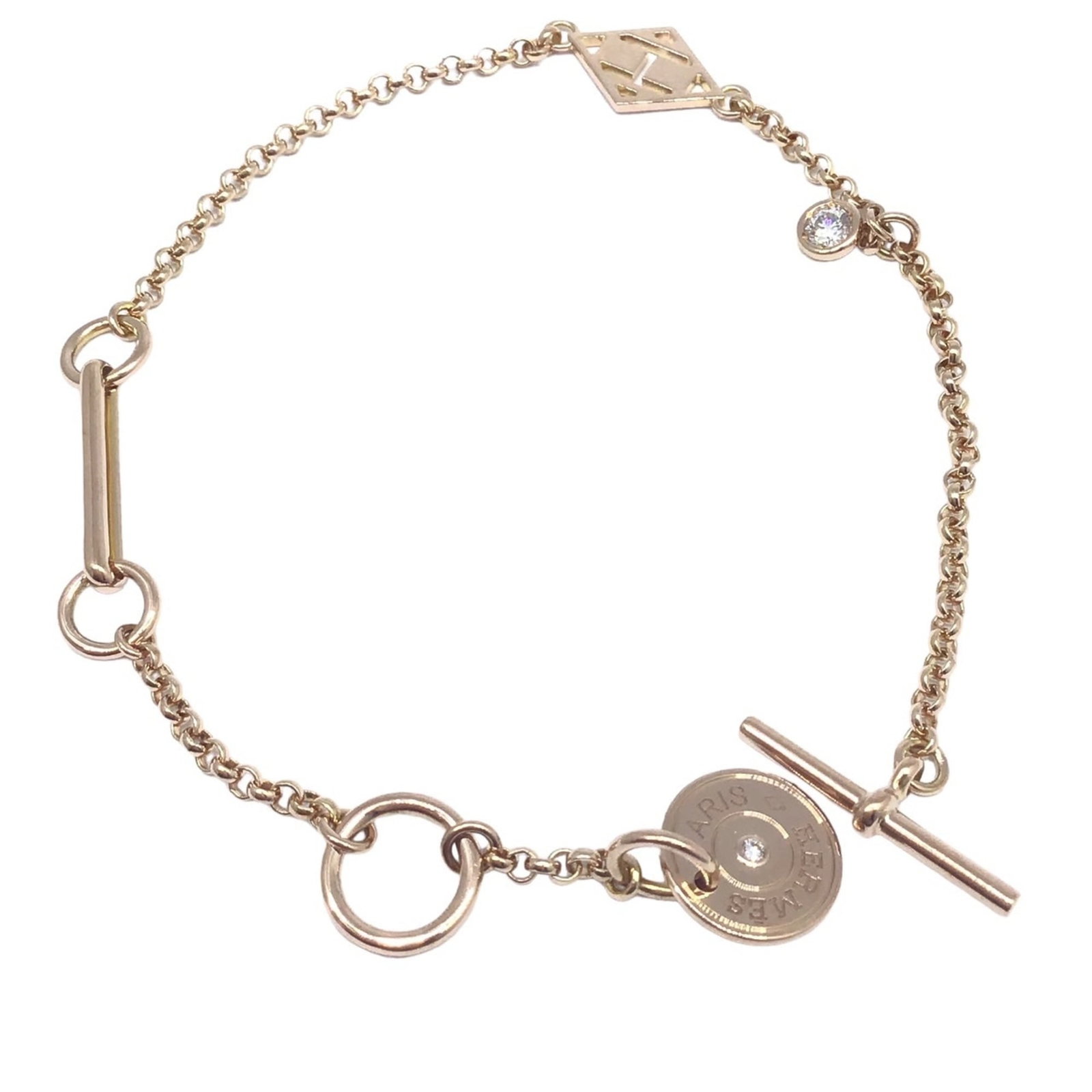 Hermes Charm Bracelet Pink Gold (18K): Hermes Charm Bracelet Pink Gold (18K) A stunning 18K pink gold charm bracelet from Hermes, crafted with attention to detail and elegance. This fashion-forward piece boasts a sleek design and measures 