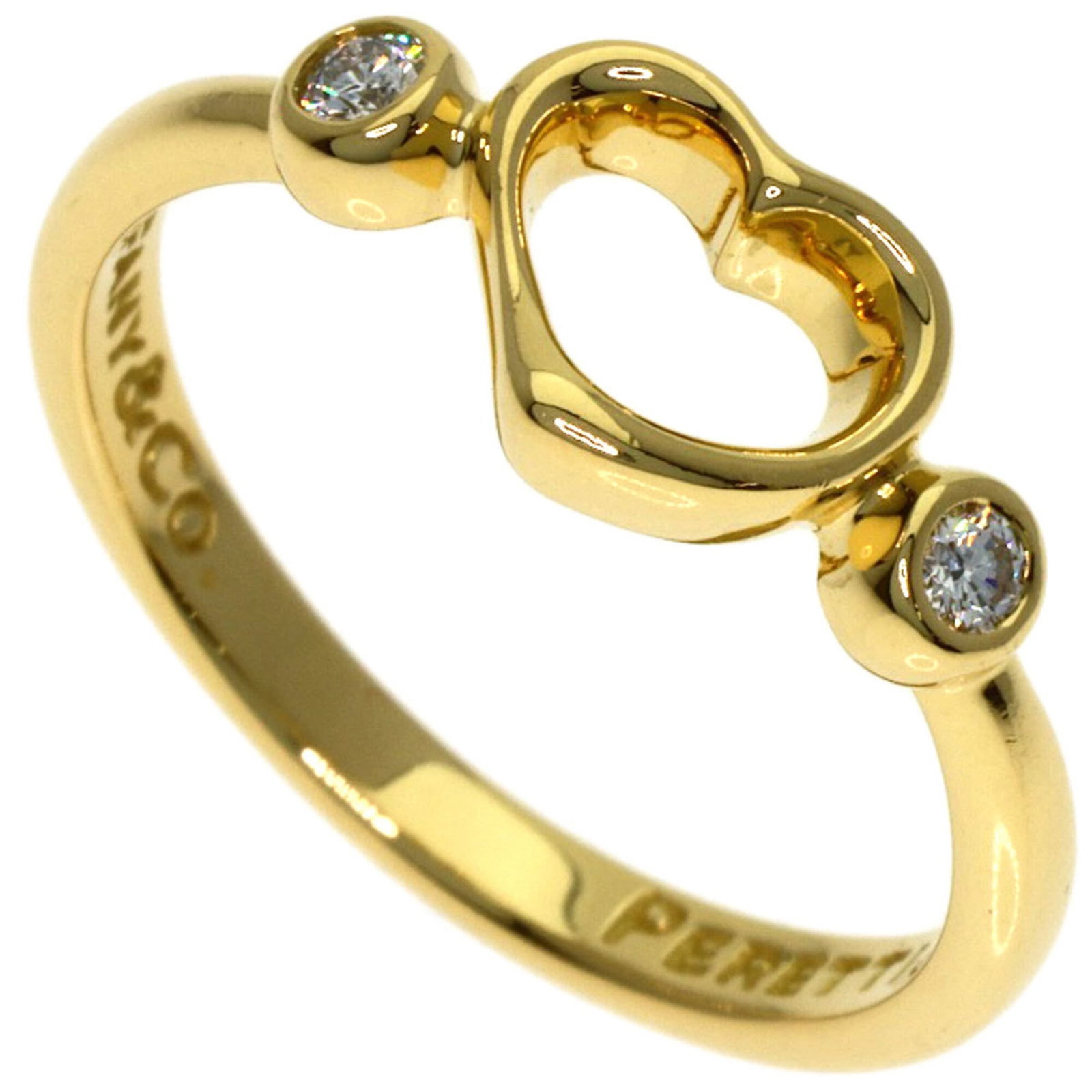 Tiffany 18k yellow gold band ring: Tiffany 18k yellow gold band ring A beautiful 18k yellow gold band ring from Tiffany, crafted with attention to detail and timeless elegance. This used ring boasts a rich, sunny hue and a slender