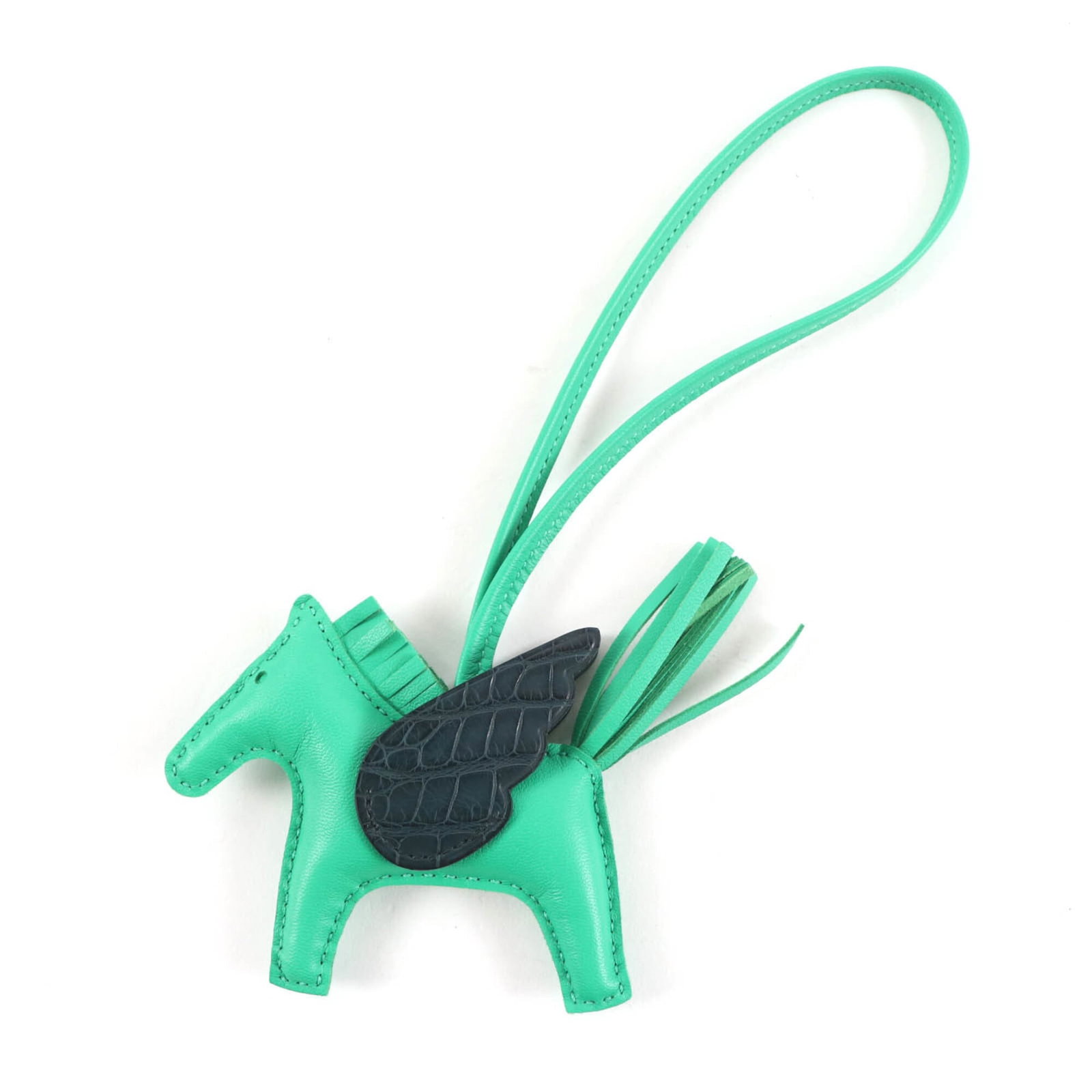 Hermes Handbag Agneau Milo: Hermes Handbag Agneau Milo A unique and stylish addition to any handbag collection is the Hermes Agneau Milo, featuring a dark green and mint green color combination in an Agneau Milo material. This