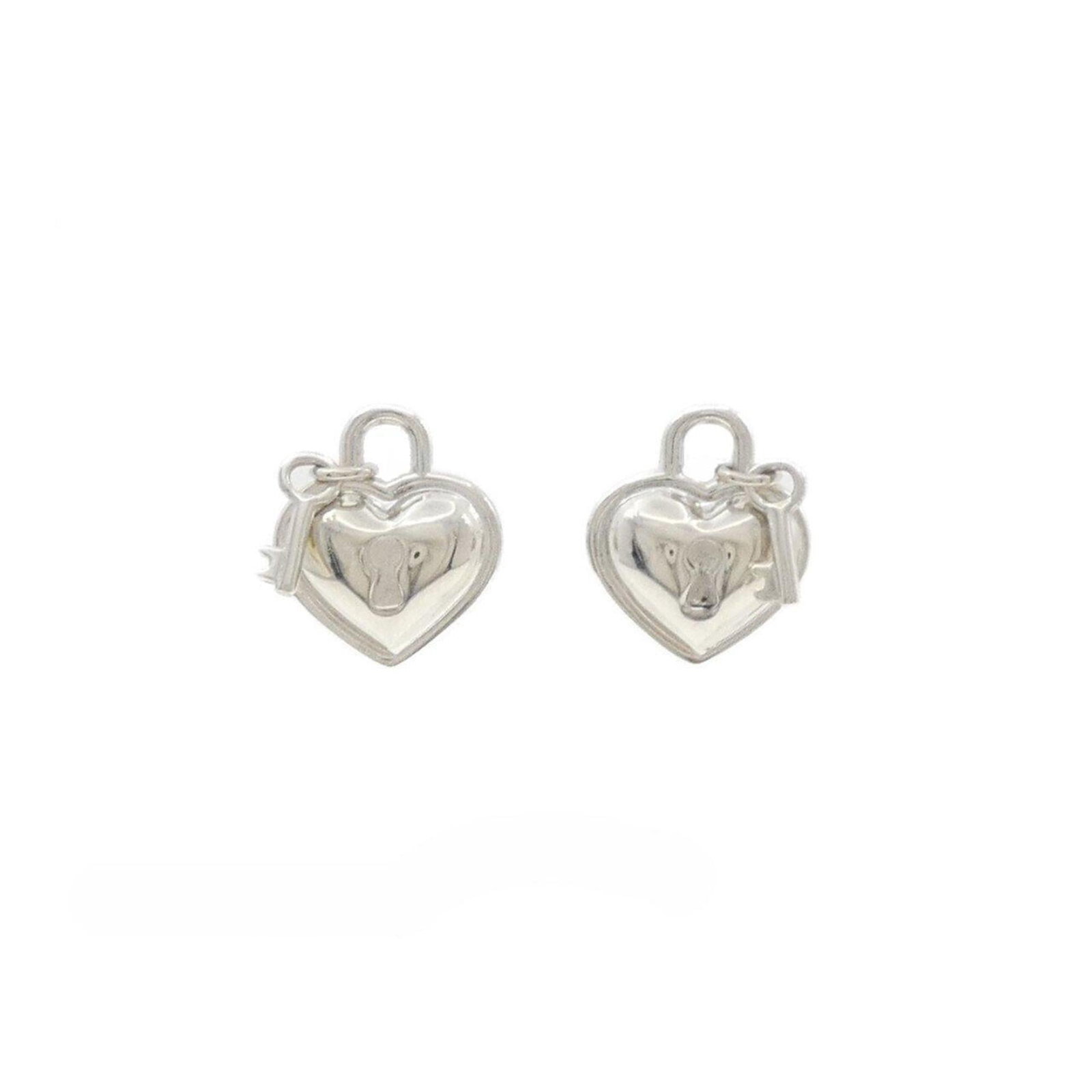 Tiffany Stud Earrings Silver 925: Tiffany Stud Earrings Silver 925 These Tiffany stud earrings are crafted from sterling silver 925 and feature a sleek, understated design. With a subtle size of 17.40mm x 15.00mm, they add a touch of