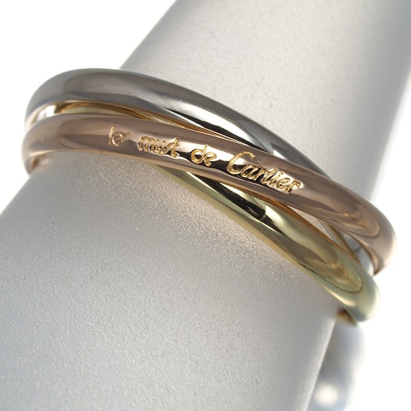 Cartier 3Color Trinity Ring in 18K Yellow White Rose Gold and Eu50.: Cartier 3Color Trinity Ring in 18K Yellow White Rose Gold and Eu50. A stunning Cartier Trinity Ring in 18k multi-tone gold, this EU50 ring showcases the iconic brand's signature blend of style and