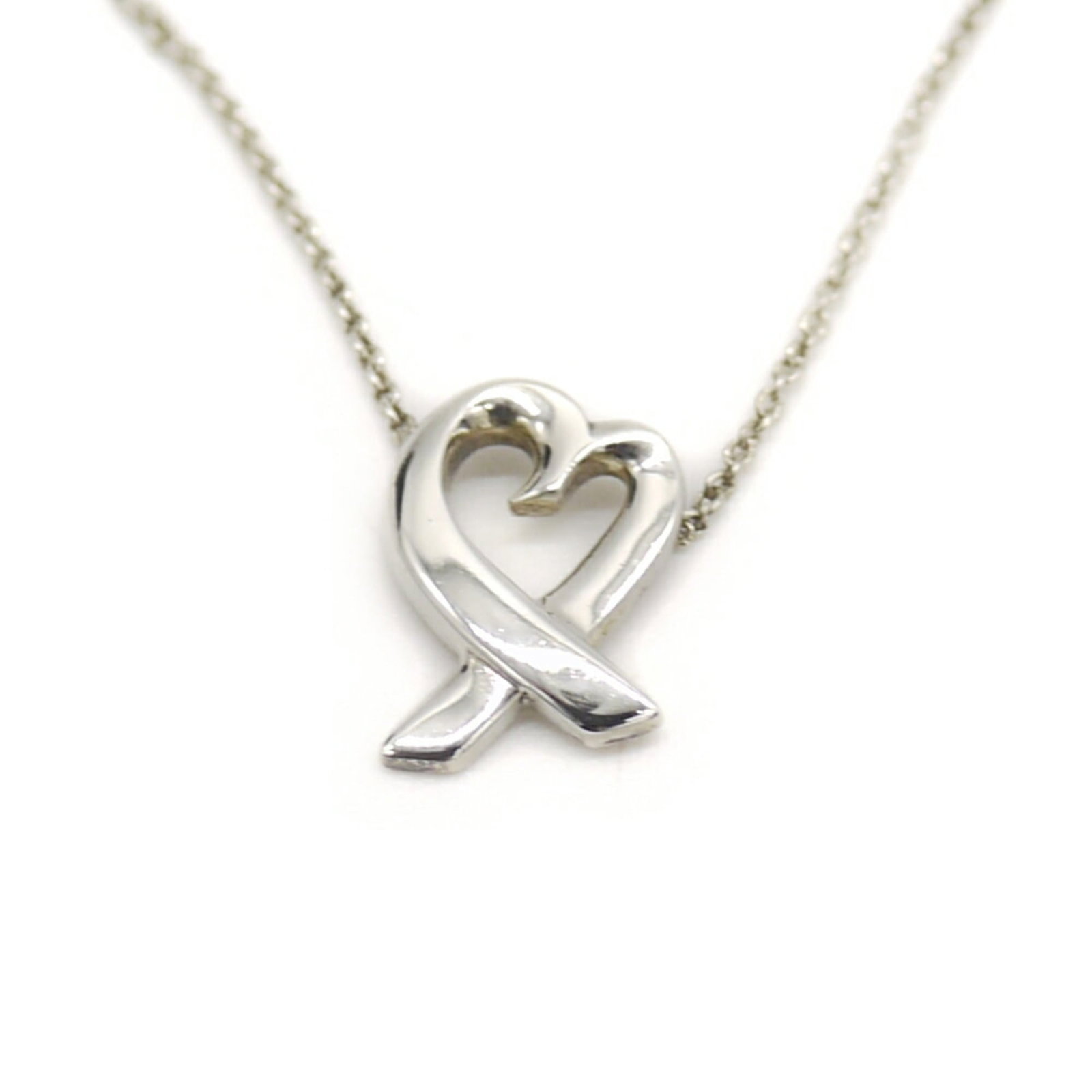 TIFFANY & Co. Tiffany Paloma Picasso Loving Heart Necklace Silver 925 Azuki Chain: TIFFANY & Co. Tiffany Paloma Picasso Loving Heart Necklace Silver 925 Azuki Chain A stunning silver necklace from Tiffany & Co., featuring the iconic Loving Heart design by Paloma Picasso. The 925