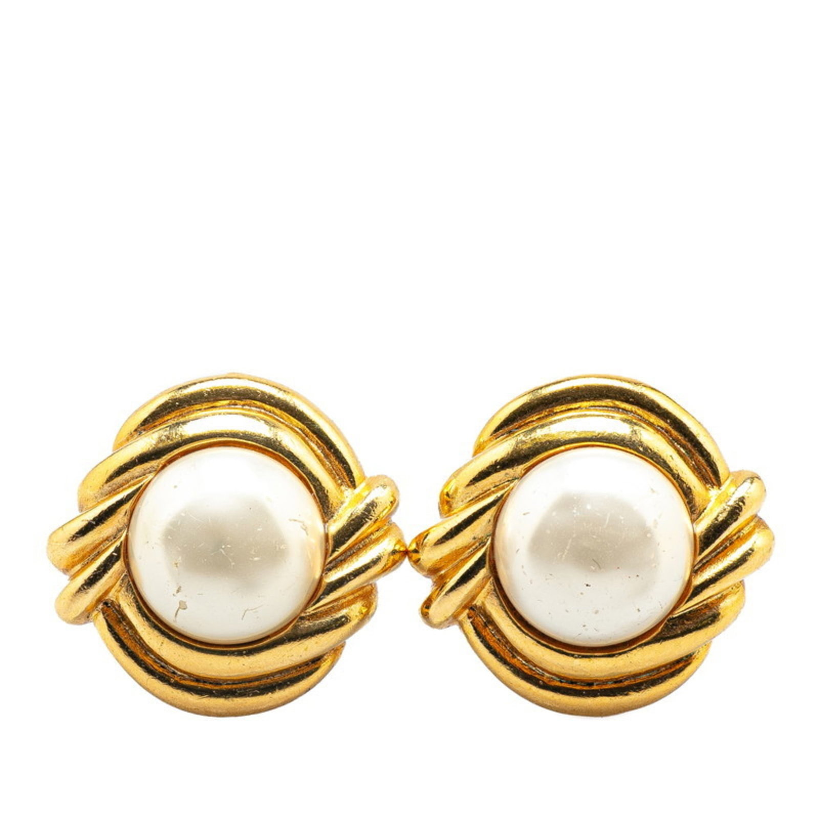 Earrings by Chanel: Earrings by Chanel Authentic Chanel clip earrings in gold, featuring a classic design with subtle scratches and signs of wear from previous use. These earrings have been well-loved but remain in good
