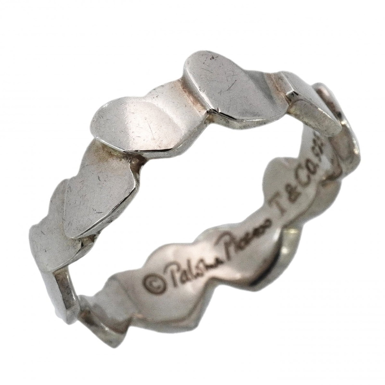 Tiffany silver ring band.: Tiffany silver ring band. A 925 sterling silver Tiffany ring band with a classic design, this used piece showcases subtle signs of wear and minor imperfections that add to its unique character. Made