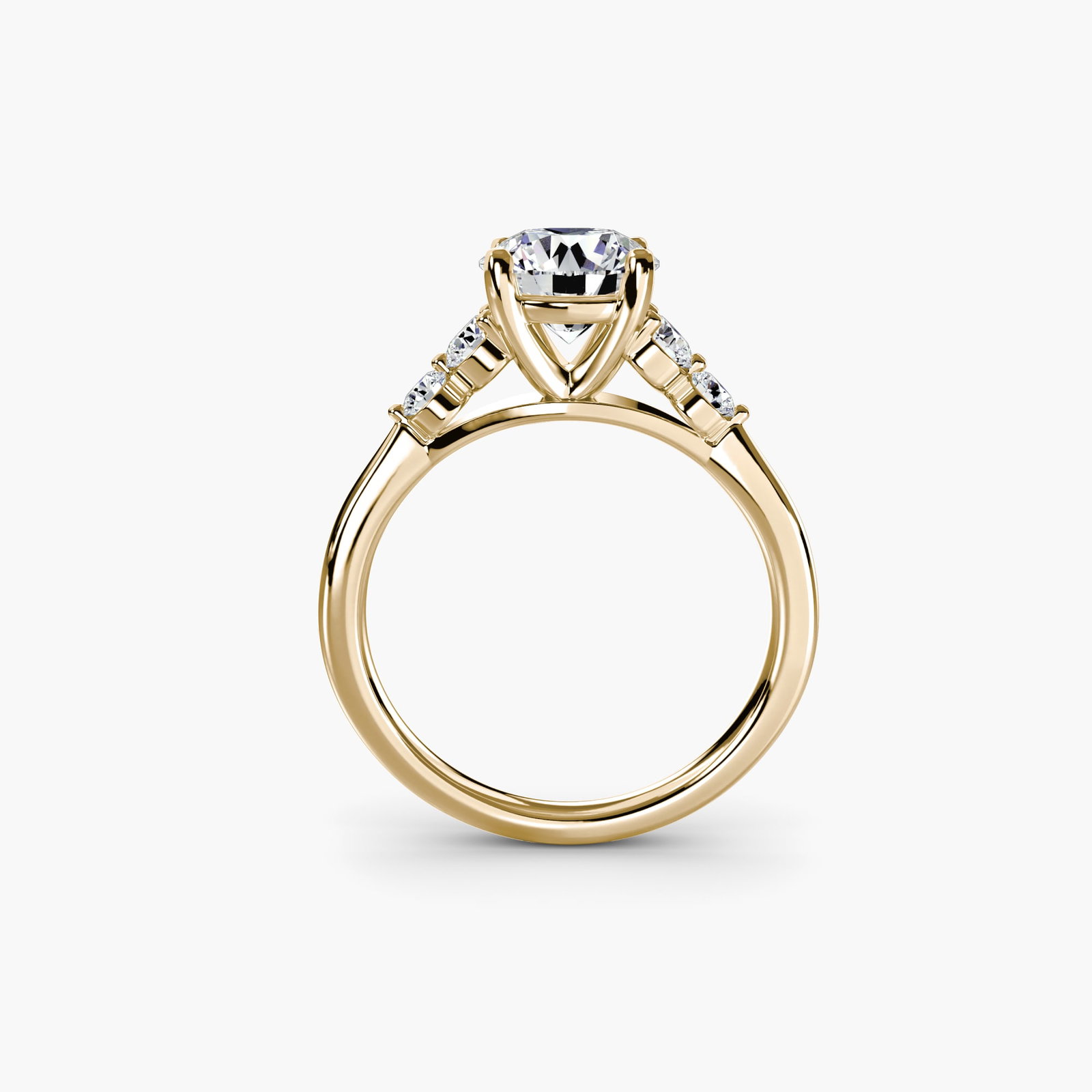 Solitaire Round 18Kt Yellow Gold Ring Setting: Solitaire Round 18Kt Yellow Gold Ring Setting Elegant simplicity is at the heart of this 18Kt yellow gold solitaire round ring setting, showcasing a beautiful band with a subtle 2mm width. The
