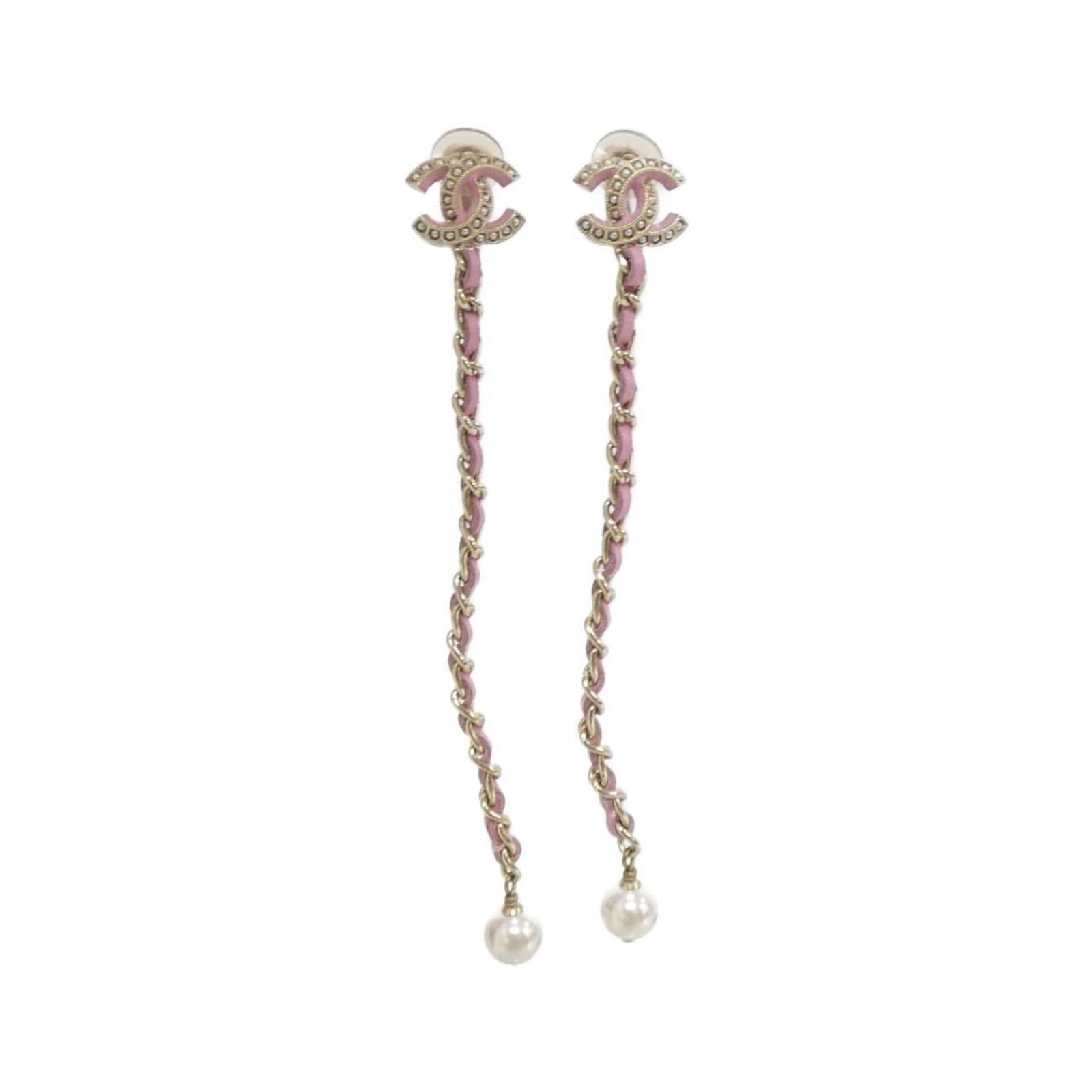 Earrings by Chanel: Earrings by Chanel Elegant Chanel clip earrings in gold, pink, and white, featuring a classic design that adds a touch of sophistication to any outfit. With their subtle details and timeless style,