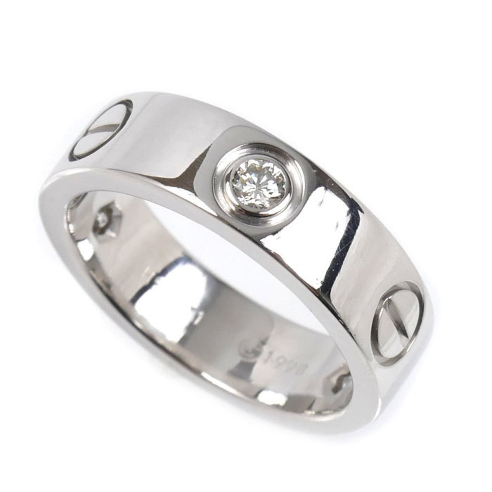 Cartier white gold ring band: Cartier white gold ring band A beautiful Cartier white gold ring band, crafted from 18K material and adorned with diamonds, adds a touch of elegance to any outfit. This pre-owned piece boasts a classi