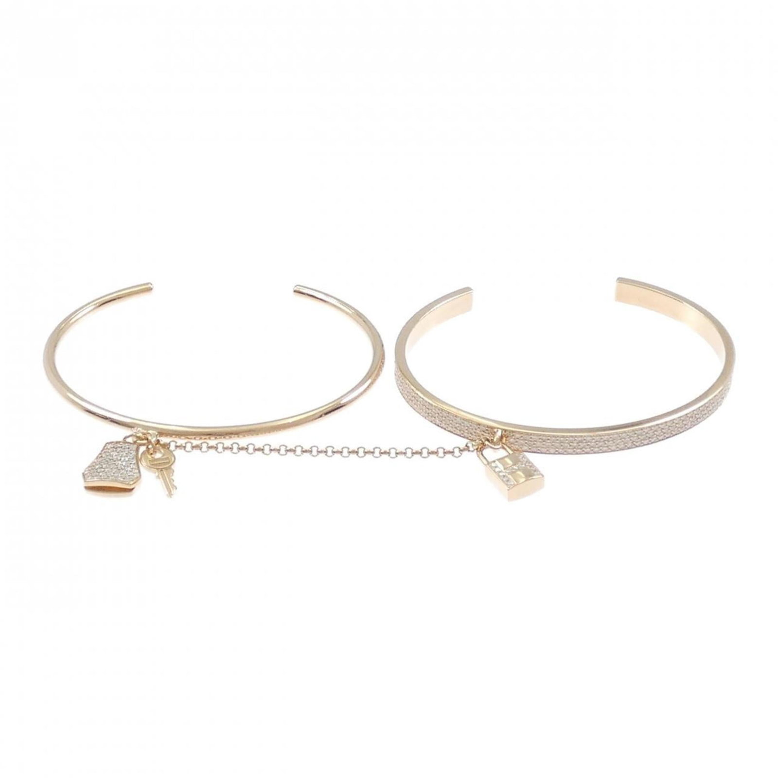 Pink Gold 18K Hermes Bangle: Pink Gold 18K Hermes Bangle A delicate touch of luxury is yours with this 18K pink gold Hermes bangle, boasting a subtle pink hue and adorned with diamonds for added elegance. Measuring 15cm in