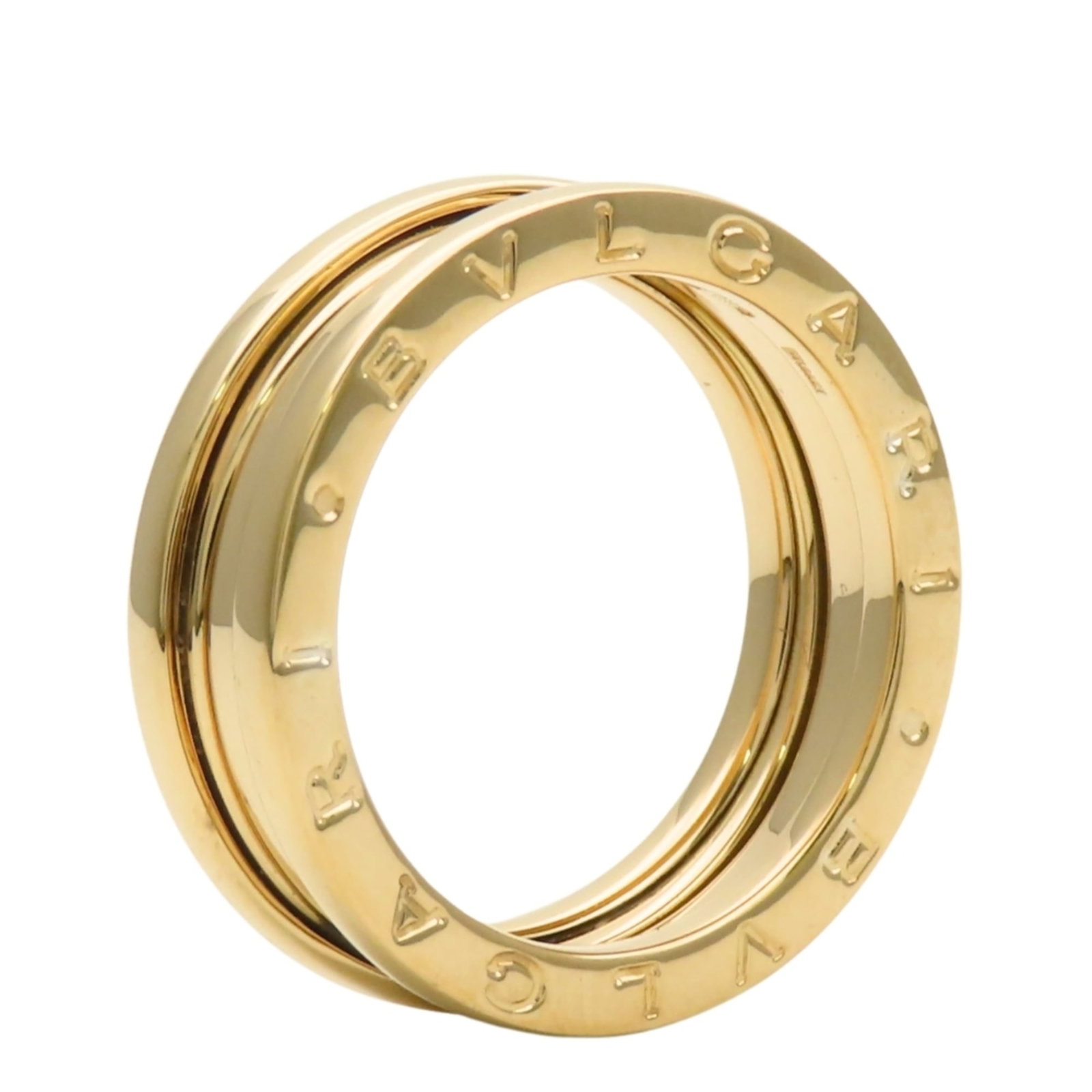 Bvlgari gold yellow band ring: Bvlgari gold yellow band ring A delicate Bvlgari band ring in 18K yellow gold, featuring a subtle yet elegant design that adds a touch of sophistication to any outfit. With its slender width and