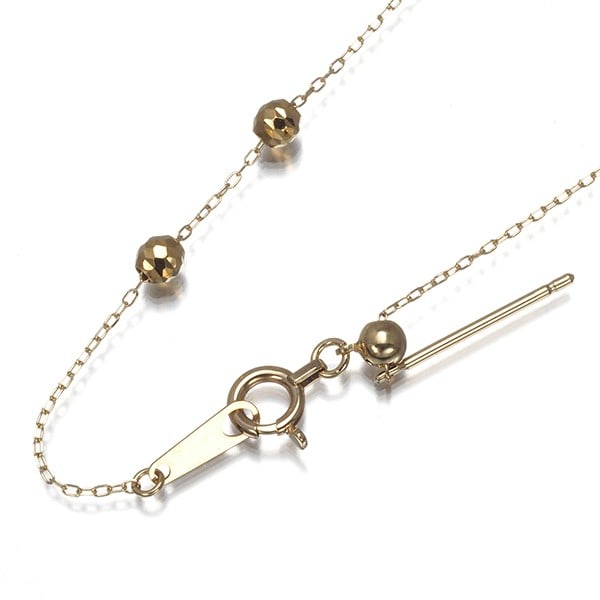 Cable Chain Necklace Cut Ball Bead 60Cm Long 10K 416 Yellow Gold: Cable Chain Necklace Cut Ball Bead 60Cm Long 10K 416 Yellow Gold A 60cm long chain necklace crafted from 10k yellow gold, featuring cut ball beads that add visual interest to its design. Made in