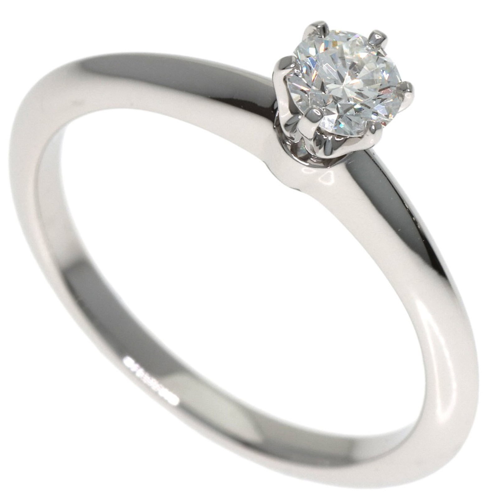 Tiffany band ring: Tiffany band ring A platinum band ring from Tiffany, featuring a 0.27 carat diamond set in a sleek design. This pre-owned ring showcases its original beauty with some minor signs of wear, including