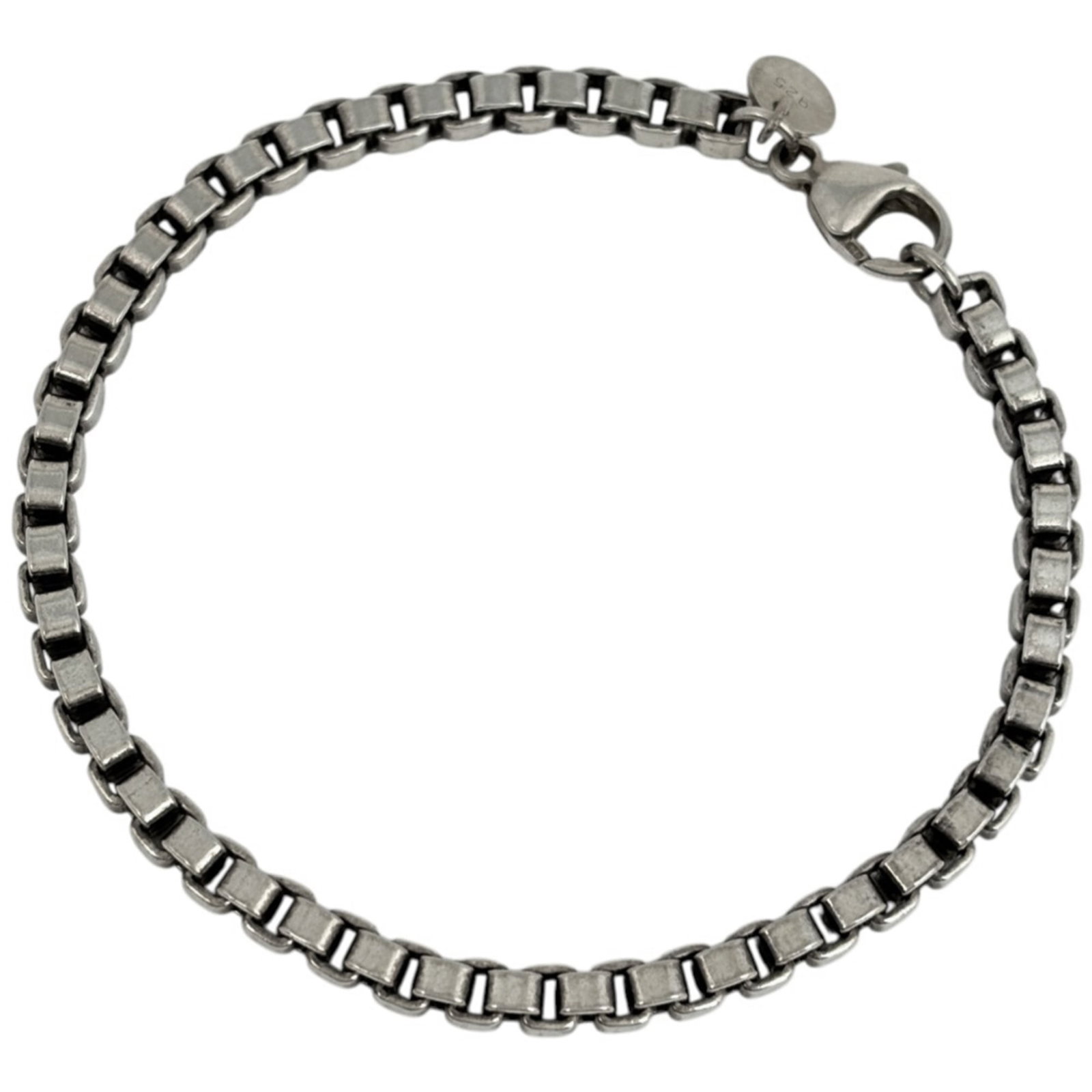 Tiffany Charm Bracelet Silver 925: Tiffany Charm Bracelet Silver 925 A delicate silver charm bracelet with a timeless touch, this 19.5cm long piece is crafted from high-quality 925 sterling silver. With its understated elegance, it