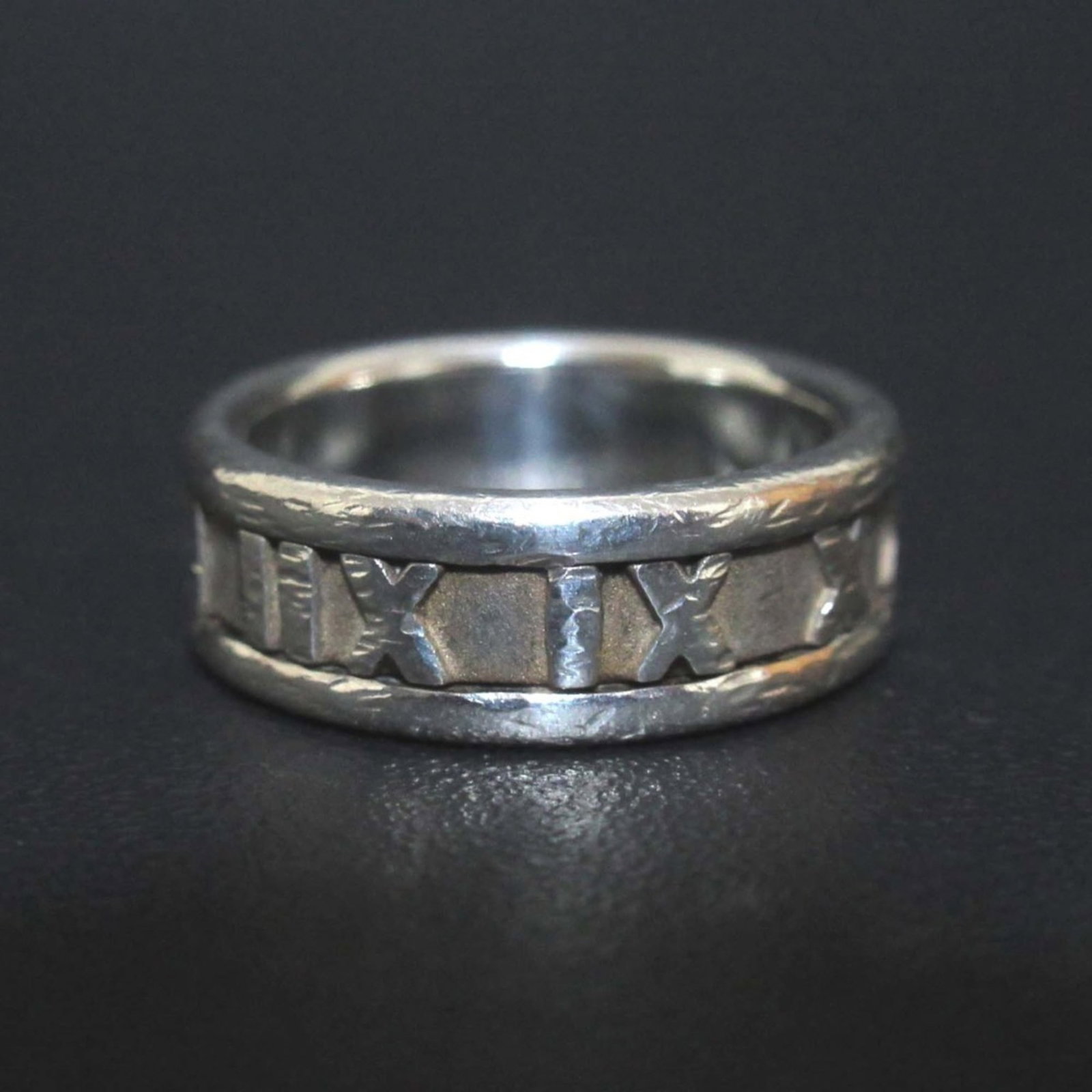 Tiffany silver ring band.: Tiffany silver ring band. A delicate Tiffany silver ring band adorns your finger with its slender 6mm width and elegant design. Crafted from sterling silver (925), this understated piece adds a touch