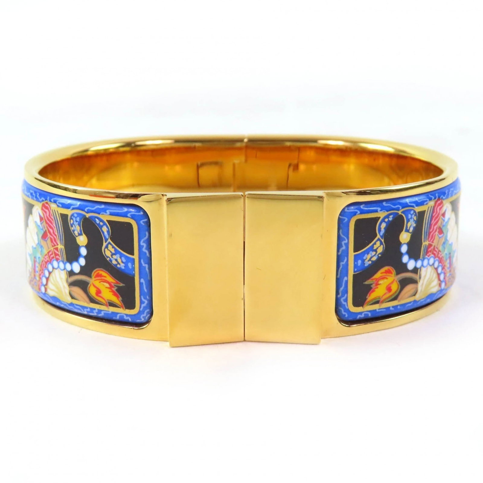 Hermes Bangle: Hermes Bangle A beautiful Hermes bangle in gold and multi-color, this 10cm diameter piece boasts a sleek design with a length of 16.5cm and width of 3cm. With its classic style and durable constructio