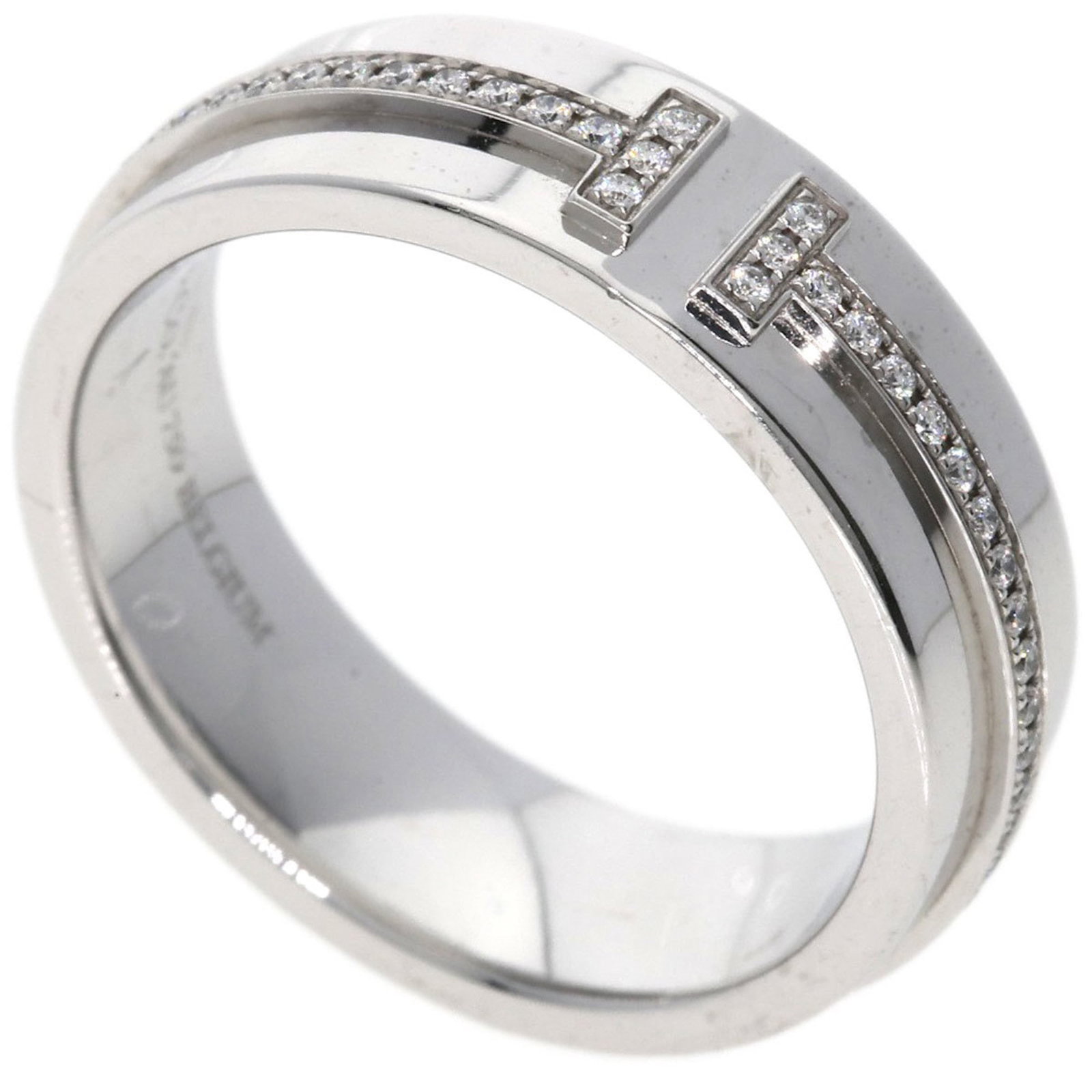 Tiffany Band Ring White Gold (18K): Tiffany Band Ring White Gold (18K) A beautiful 18K white gold band ring from Tiffany featuring a diamond stone, this versatile piece is designed to complement any style. With its classic design and du