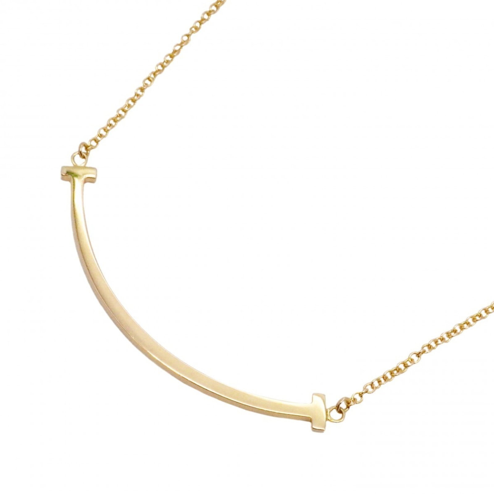 Tiffany & Co. T Smile Small Necklace, 18K Pink Gold, Women's: Tiffany & Co. T Smile Small Necklace, 18K Pink Gold, Women's A delicate 18K pink gold necklace from Tiffany & Co., featuring the iconic T Smile pendant. This charming piece is crafted in a petite size