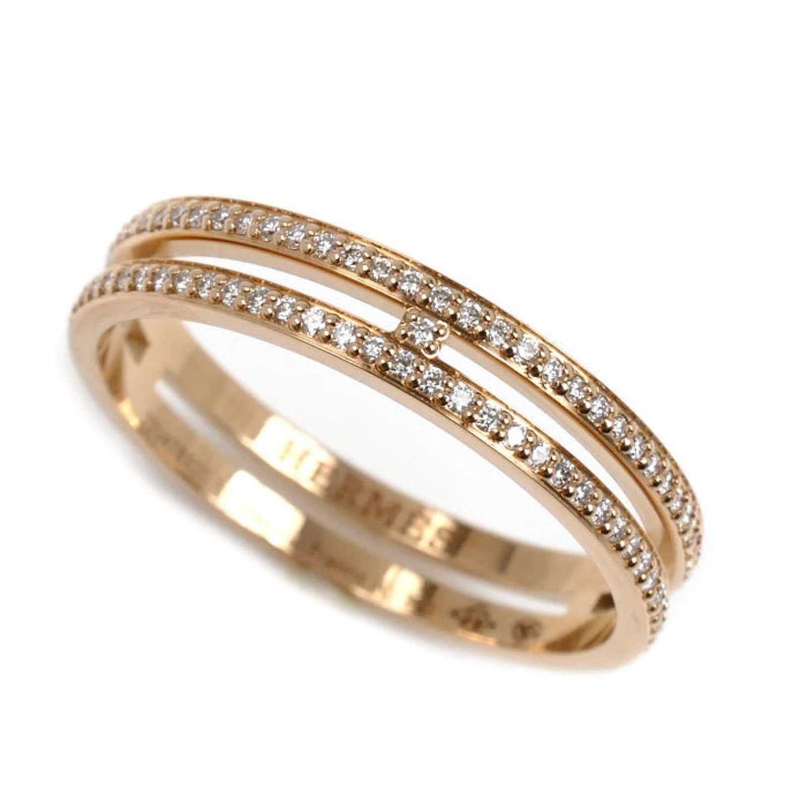 Pink Gold 18K Hermes Ring Band: Pink Gold 18K Hermes Ring Band A statement piece for the modern woman, this 18K pink gold ring band from Hermes boasts a sleek design that adds a touch of elegance to any outfit. With its subtle pink 