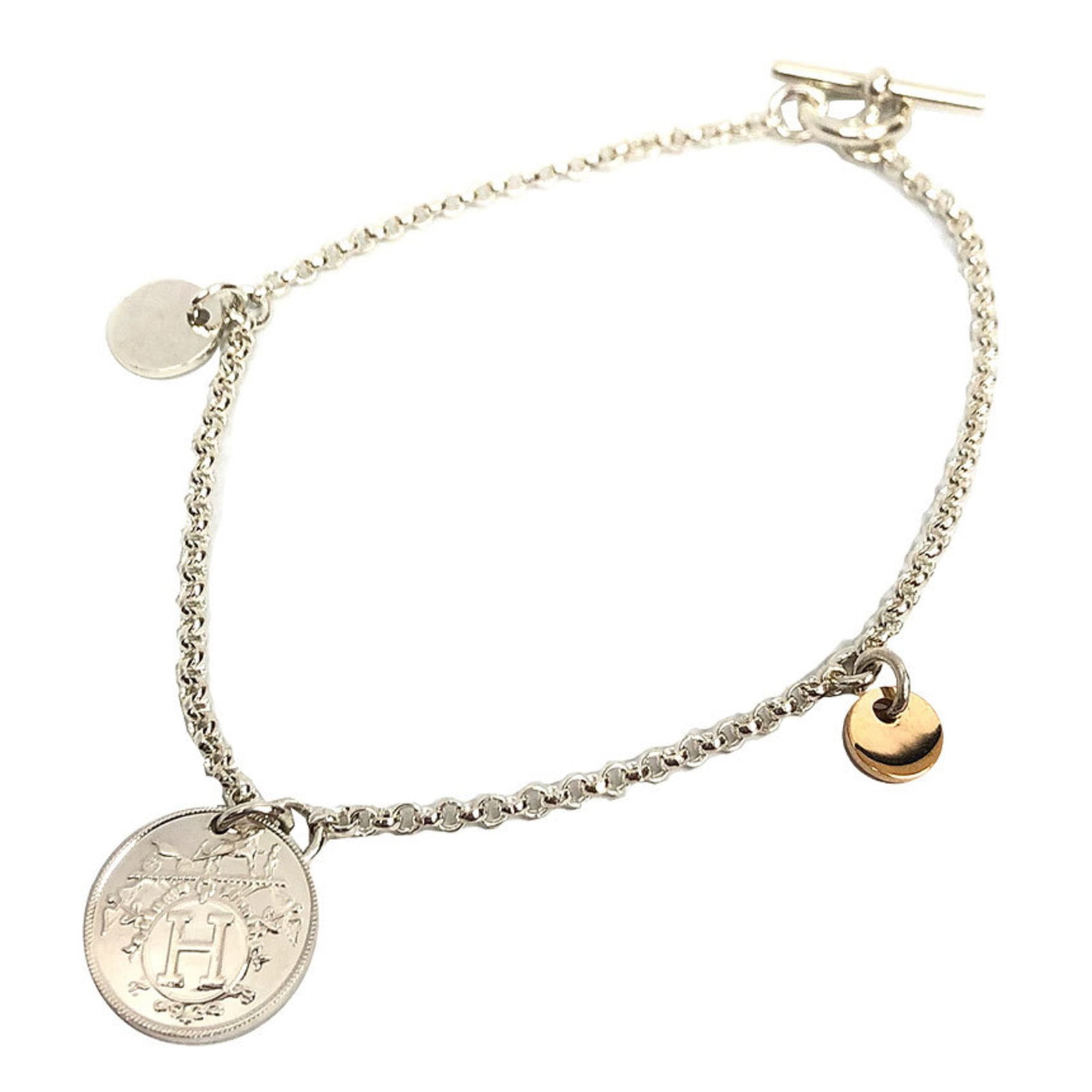 Pink Gold 18K Hermes Silver 925 Bracelet: Pink Gold 18K Hermes Silver 925 Bracelet A stunning 18K pink gold and silver 925 charm bracelet from the iconic Hermes brand, featuring a sleek and modern design with a subtle touch of femininity.