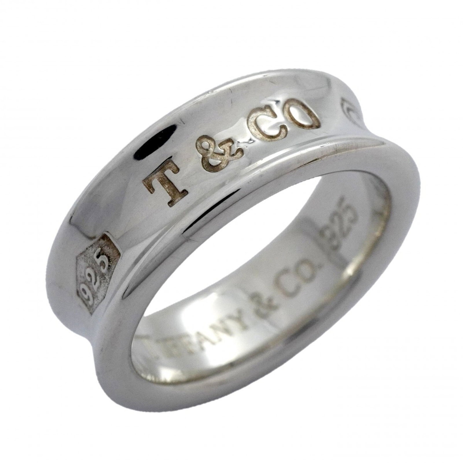 Tiffany silver ring band.: Tiffany silver ring band. A 925 sterling silver ring band from Tiffany, available in US size 6.5, offers a touch of elegance to any outfit. With its classic design and durable construction, this ring