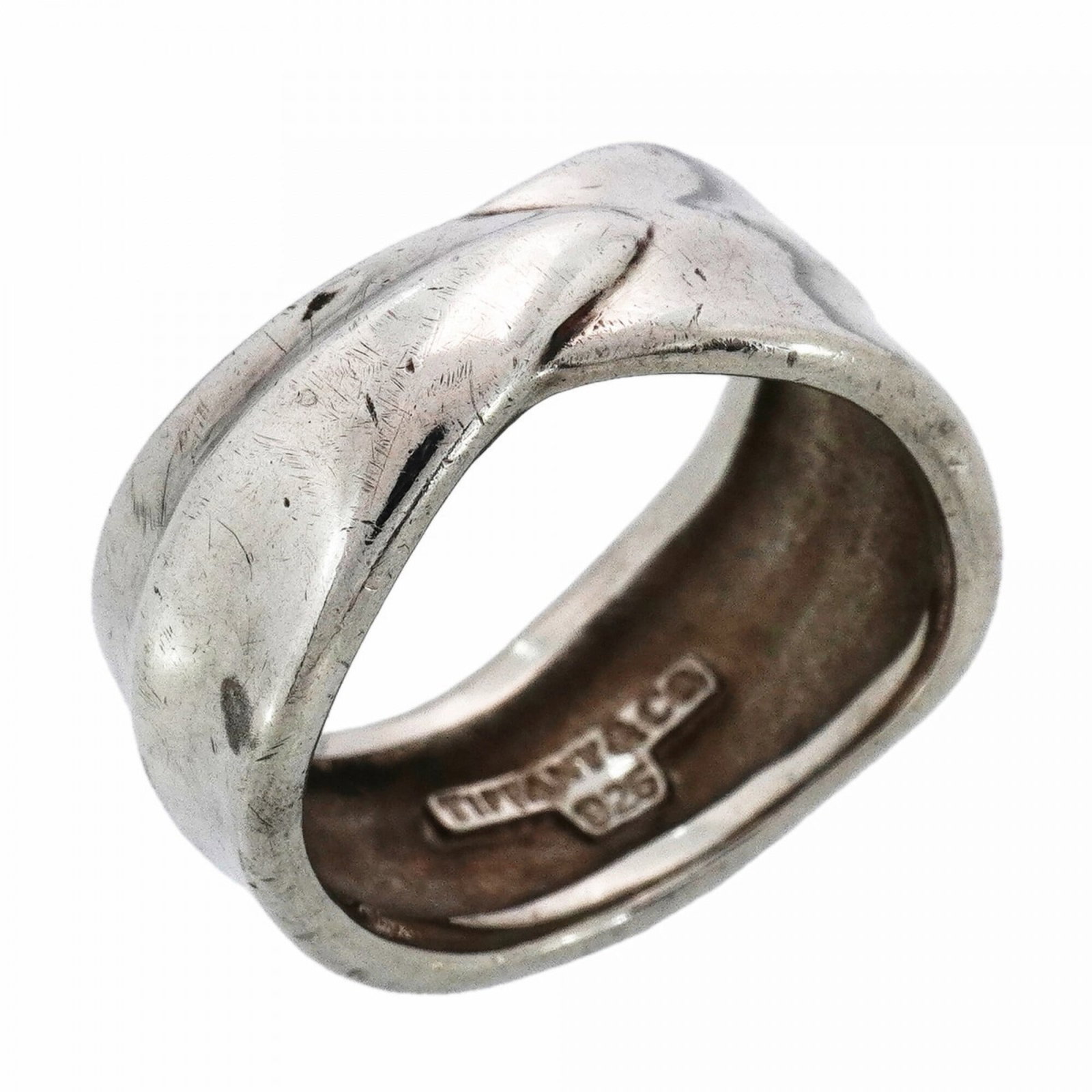 Tiffany silver ring band.: Tiffany silver ring band. A beautiful Tiffany silver ring band with a classic design, this 925 sterling silver piece is available in a women's US size 6.5. With some signs of gentle wear and tear, it