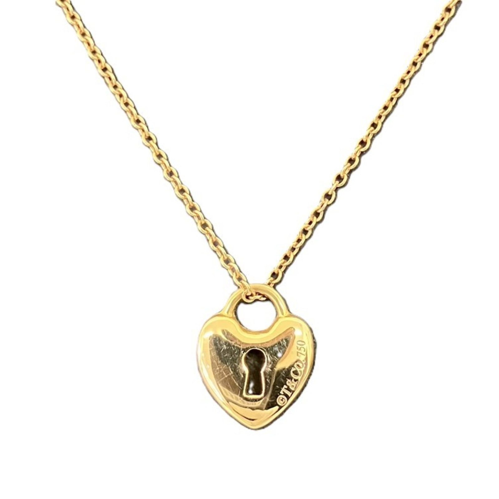 Tiffany Heart Lock 750 Necklace, 2.9g, 18K: Tiffany Heart Lock 750 Necklace, 2.9g, 18K A stunning 18K gold necklace from Tiffany & Co., this Heart Lock design boasts a sleek and elegant silhouette. With its 2.9g weight, it's a statement piece