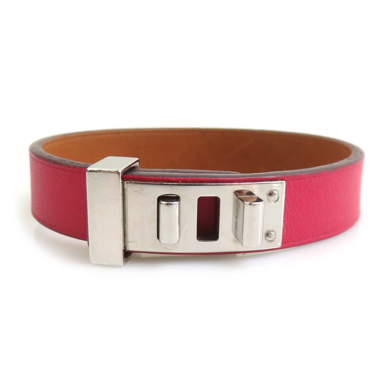 Hermes Leather Metal Charm Bracelet: Hermes Leather Metal Charm Bracelet A sleek and sophisticated accessory for the modern woman, this Hermes leather metal charm bracelet boasts a striking silver finish and premium leather details.