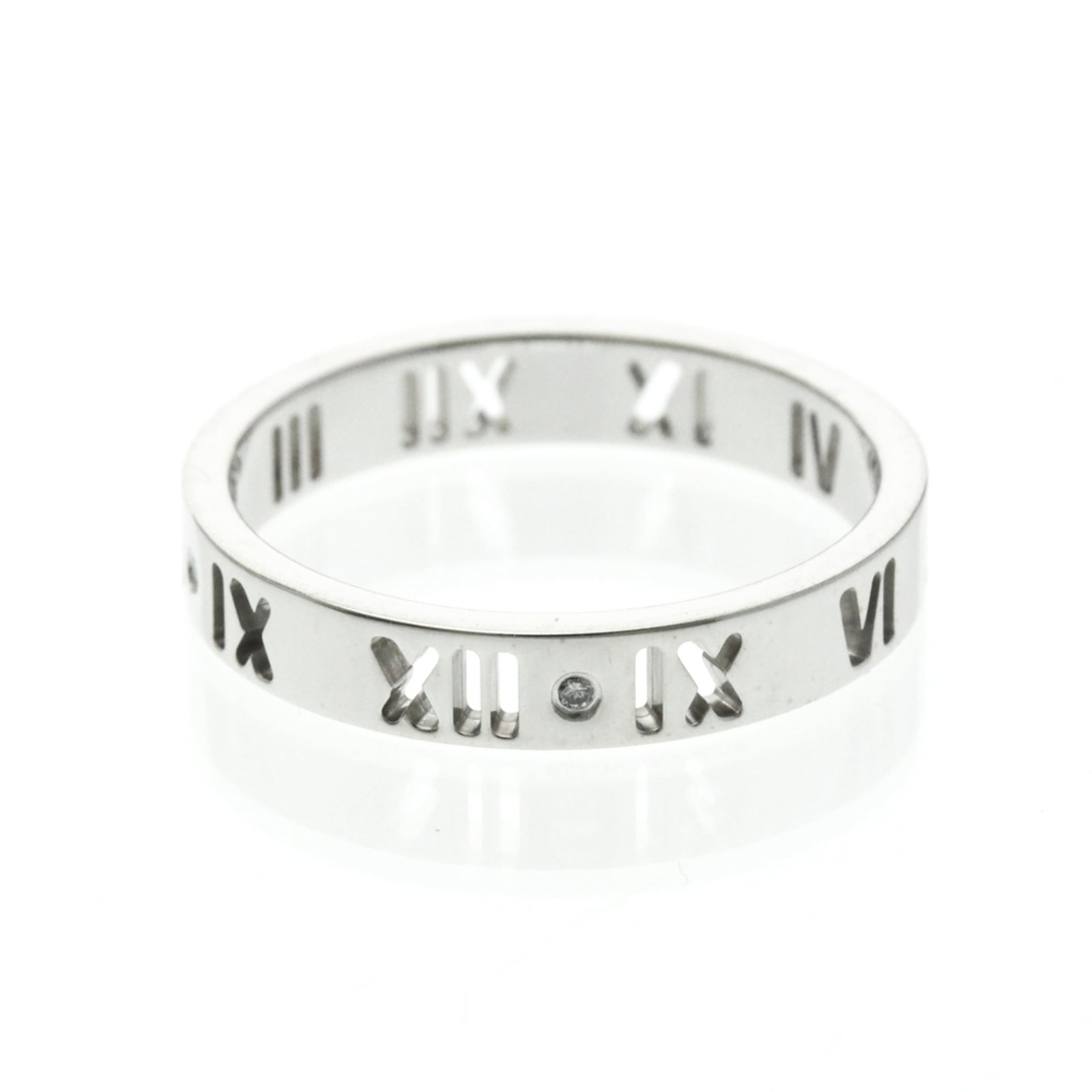 Tiffany Band Ring White Gold (18K): Tiffany Band Ring White Gold (18K) A sleek Tiffany band ring in 18K white gold, this fashion-forward piece boasts a slender profile and elegant design. With its diamond stone and silver tone, it adds