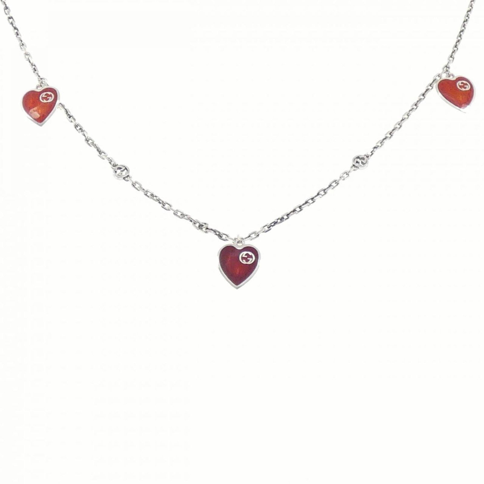 Gucci a heart resin necklace: Gucci a heart resin necklace A delicate Gucci heart resin necklace, crafted from silver 925 and featuring a small, intricate pendant, is up for auction. This necklace boasts a sleek design with