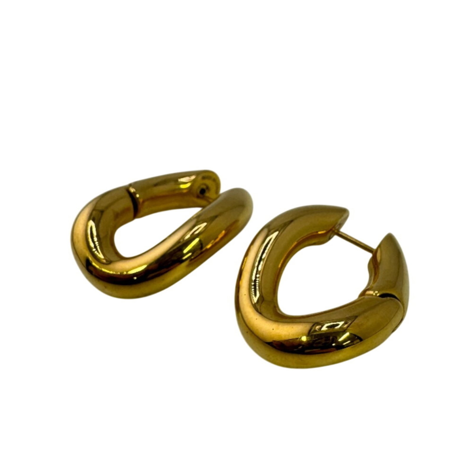 Gold plating hoop earrings from Balenciaga: Gold plating hoop earrings from Balenciaga Unique Balenciaga gold plating hoop earrings with a distinctive 35mm x 27mm size and subtle signs of wear, giving them a gently used charm. The gold plating