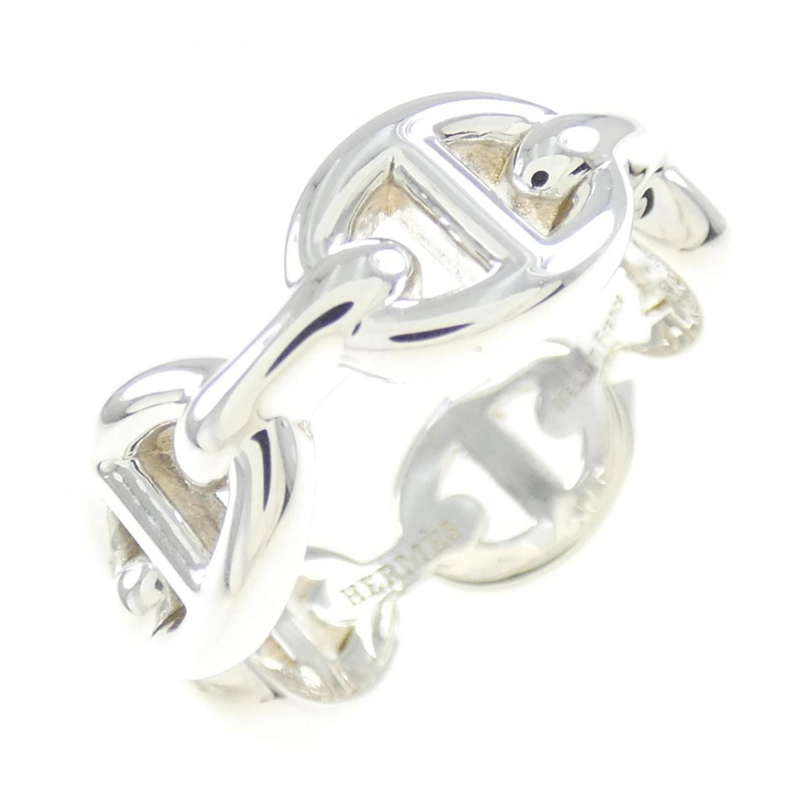 Silver band ring from Hermes.: Silver band ring from Hermes. A sleek and sophisticated silver band ring from renowned luxury brand Hermes, featuring a 7mm width and 925 sterling silver construction. This used ring showcases a few